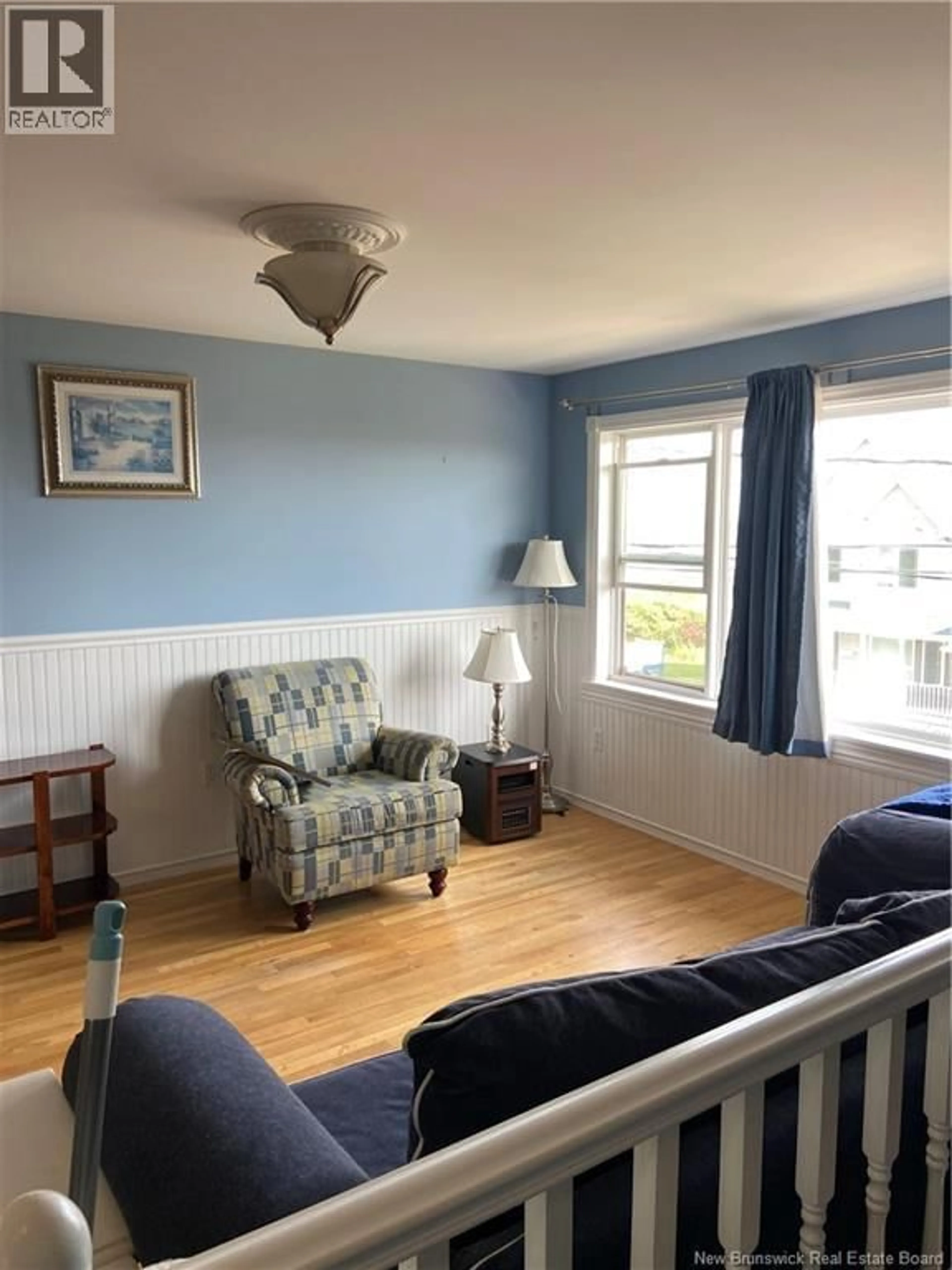 Living room with furniture, wood/laminate floor for 1 WALSH PLACE, Saint John New Brunswick E2M3B2