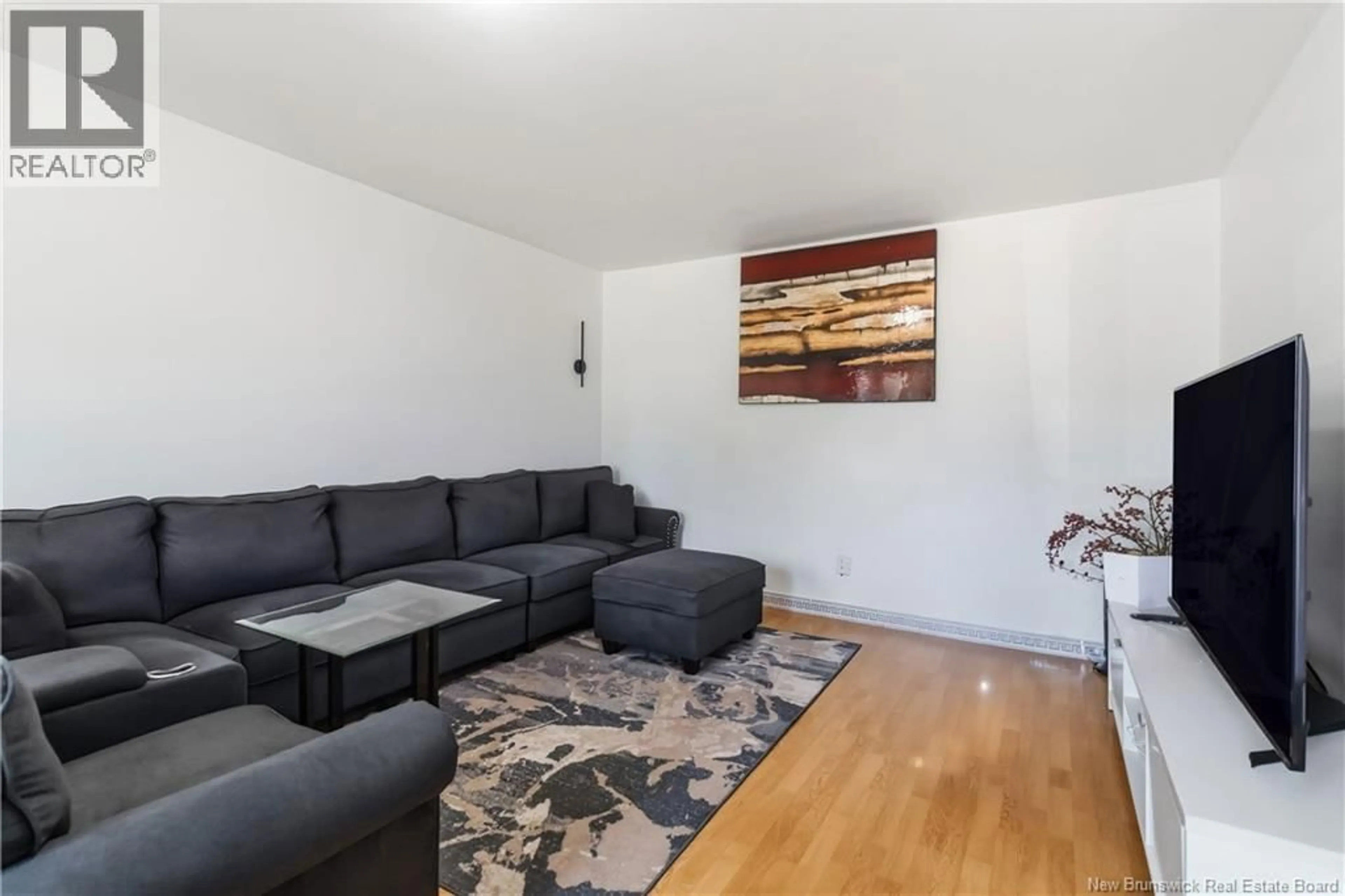 Living room with furniture, wood/laminate floor for 234-236 AYER AVENUE, Moncton New Brunswick E1C8G8