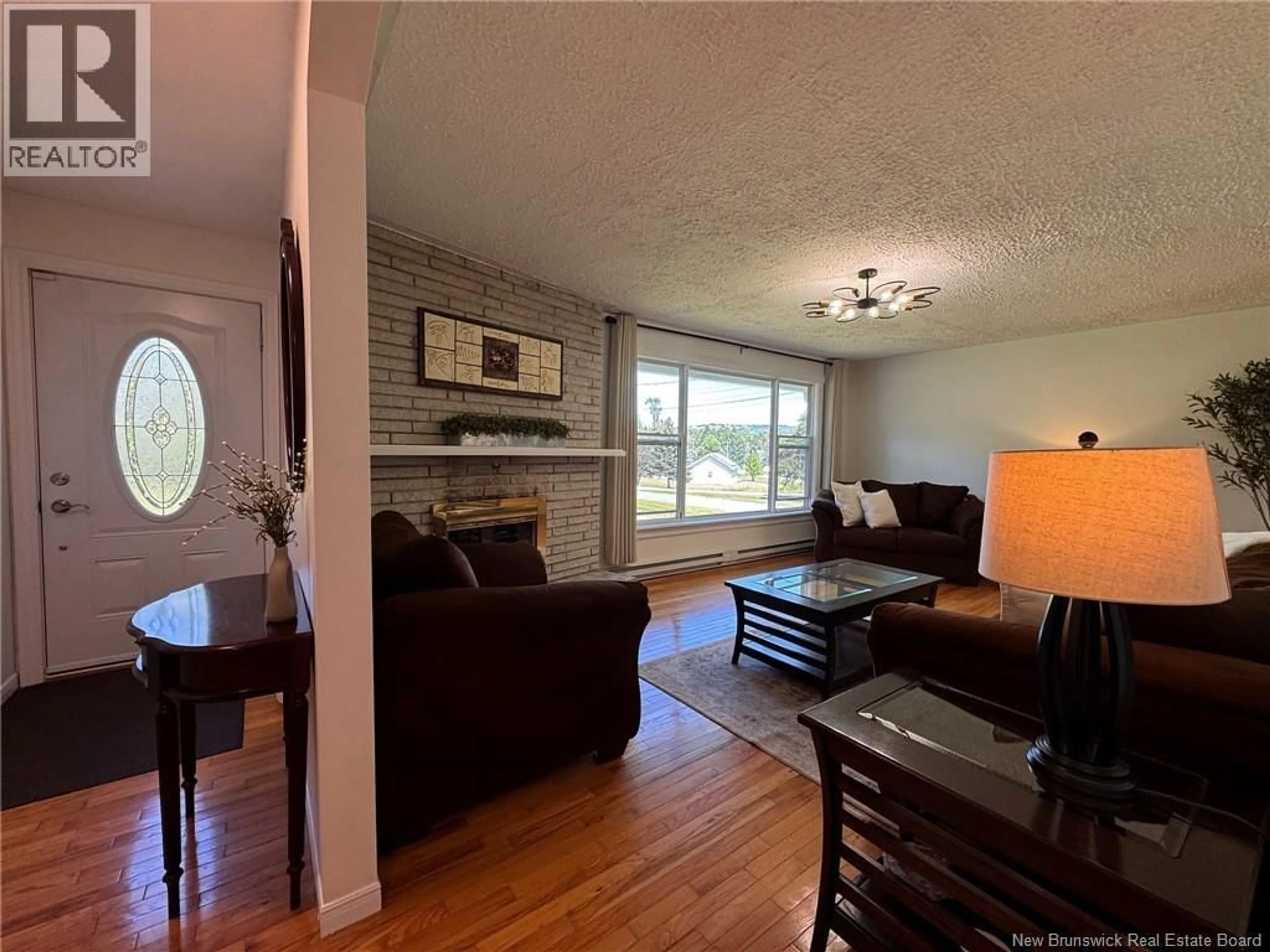 Living room with furniture, wood/laminate floor for 13 WOODWARD CRESCENT, Quispamsis New Brunswick E2E1N5