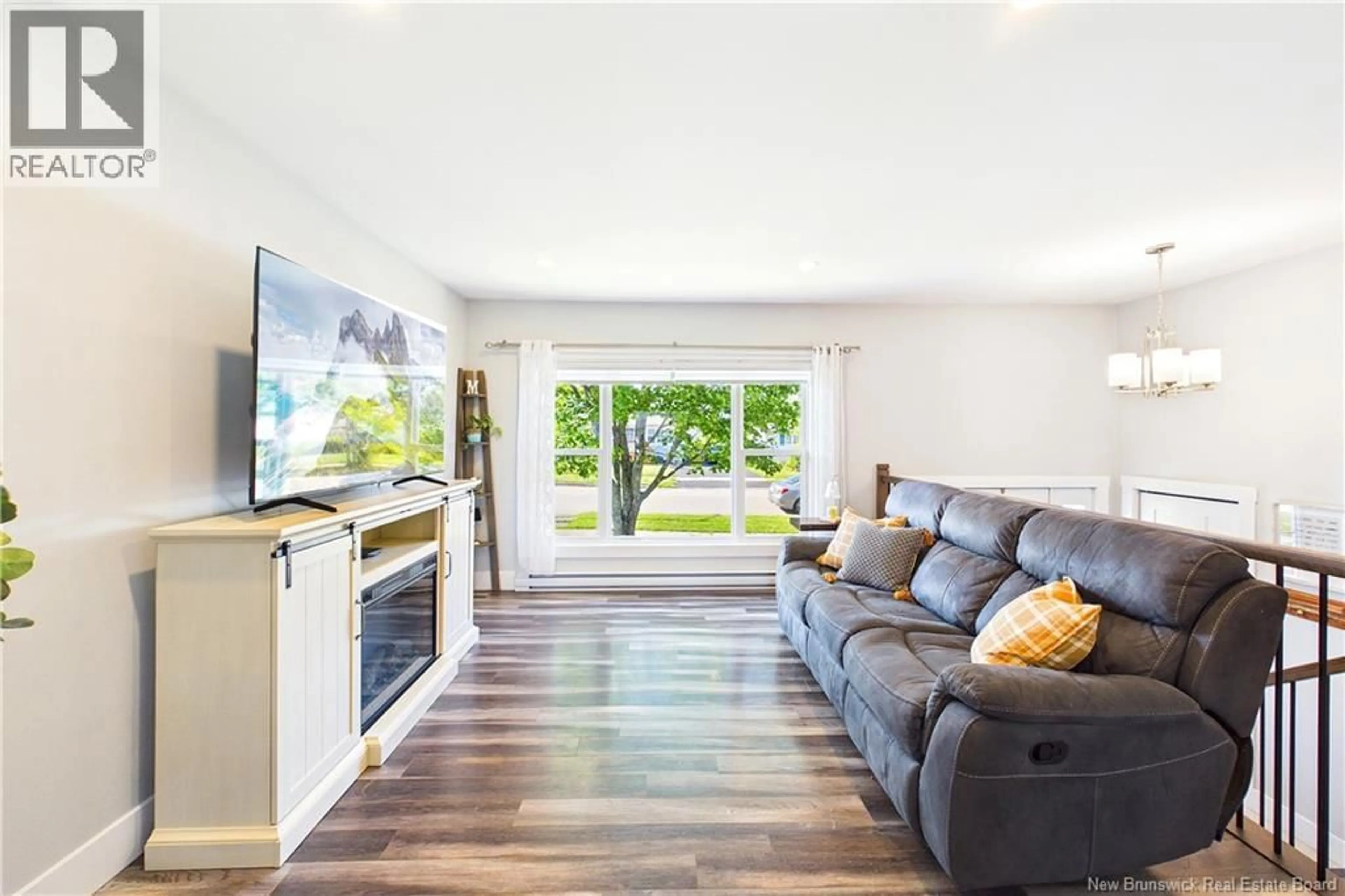 Living room with furniture, wood/laminate floor for 65 SATINWOOD DRIVE, Moncton New Brunswick E1G1C3
