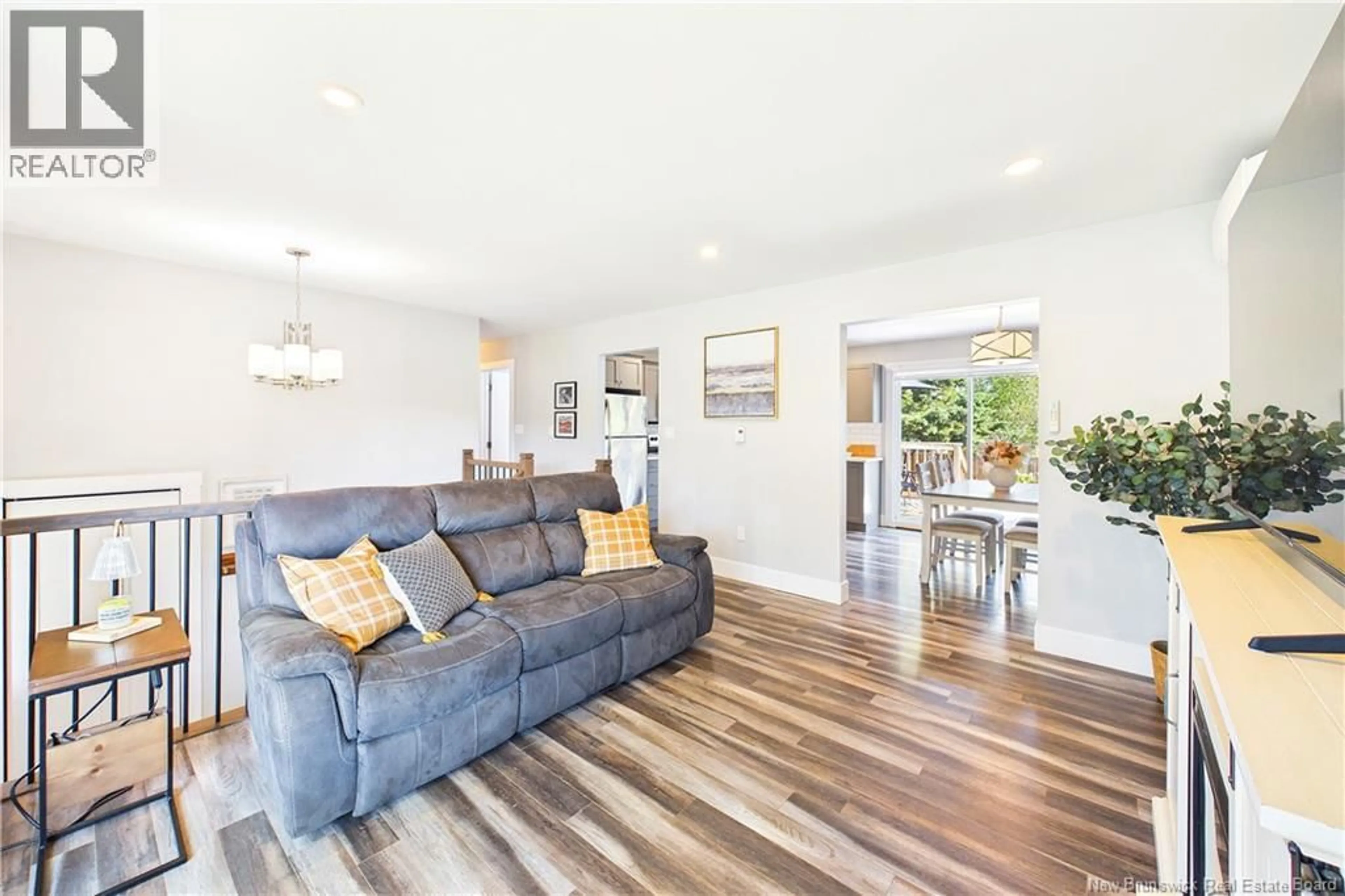 Living room with furniture, wood/laminate floor for 65 SATINWOOD DRIVE, Moncton New Brunswick E1G1C3