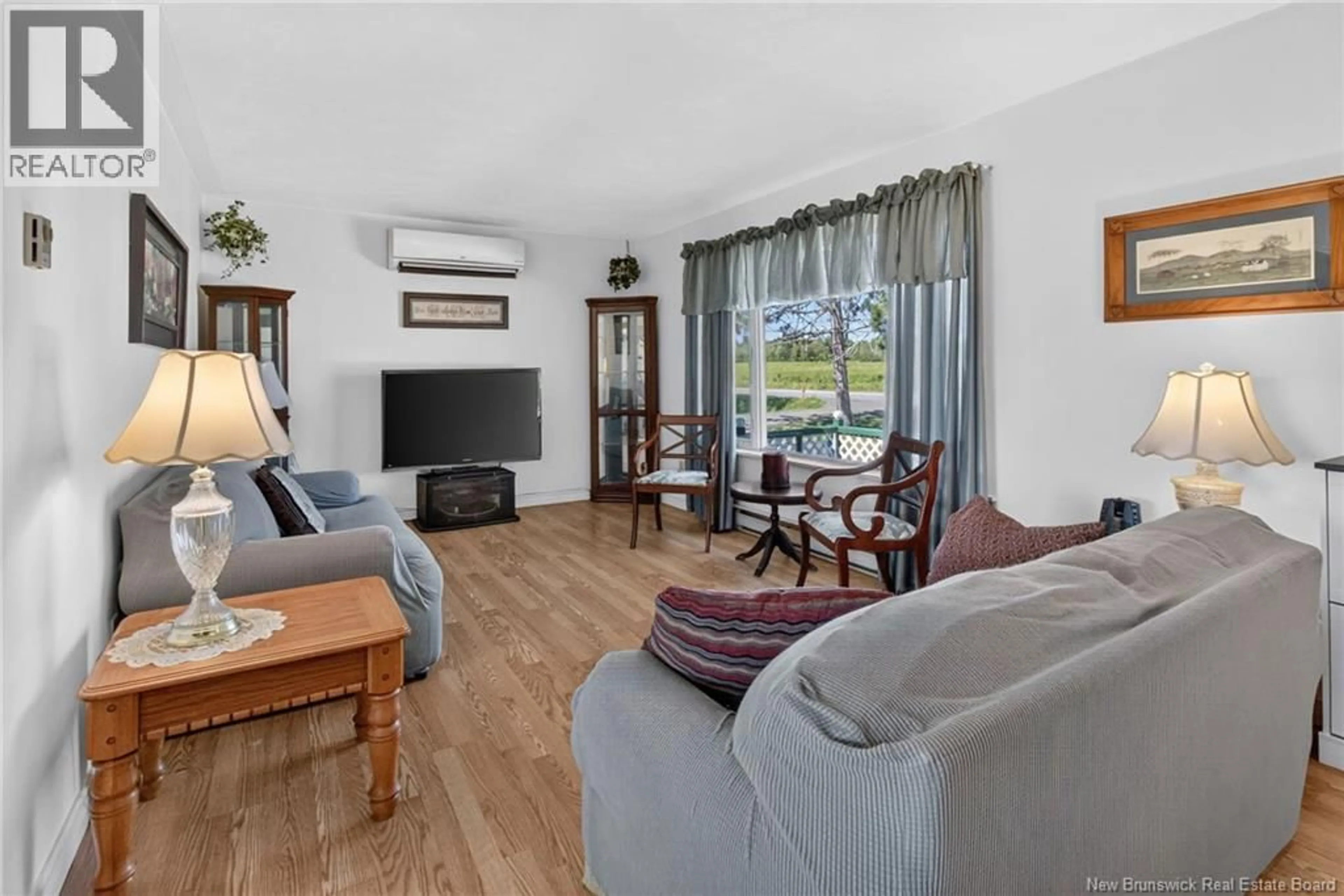 Living room with furniture, wood/laminate floor for 3468 ROUTE 106, Salisbury New Brunswick E4J3H6