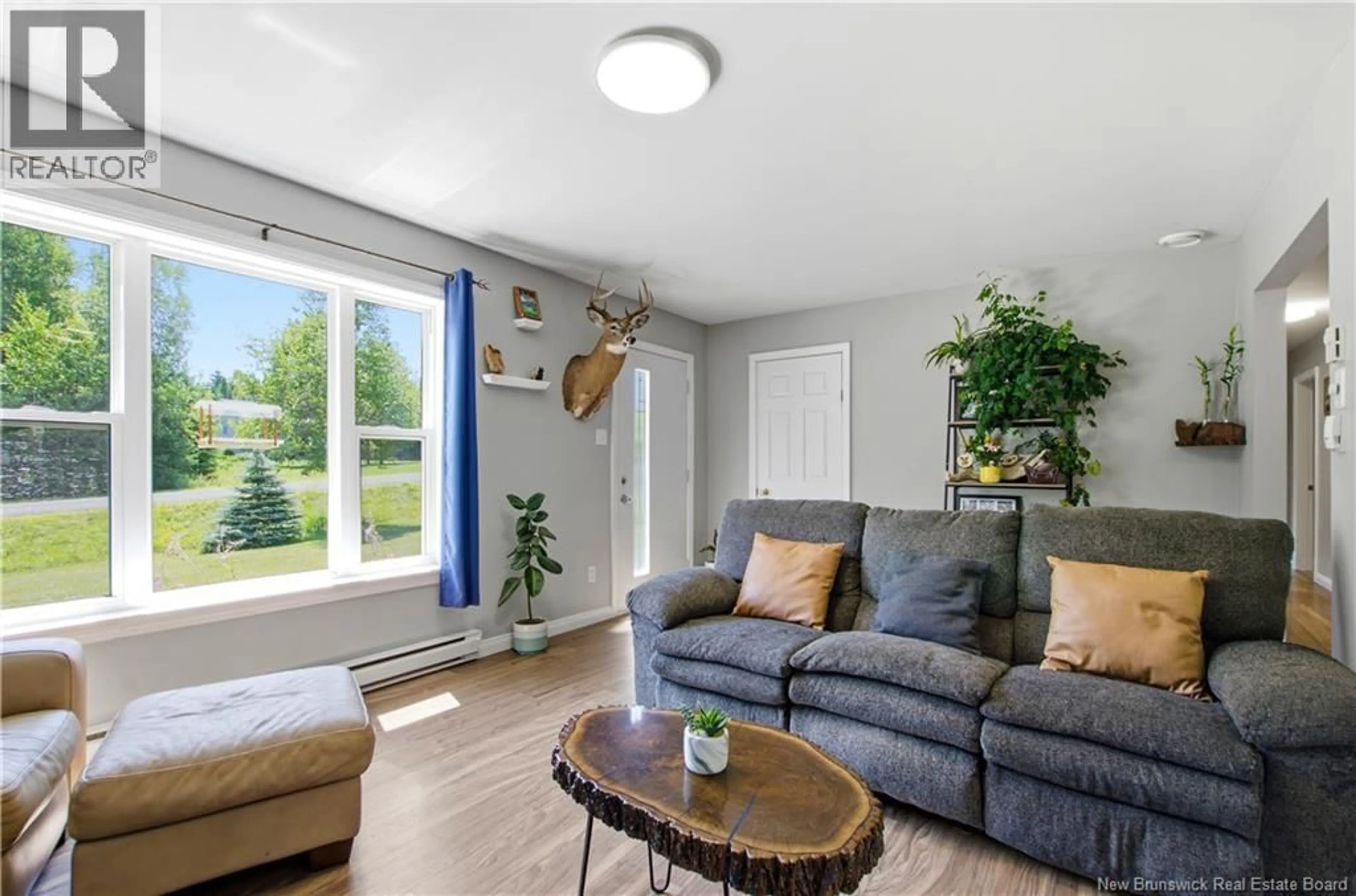 Living room with furniture, wood/laminate floor for 61 LINT DRIVE, McLeod Hill New Brunswick E3G5Y6