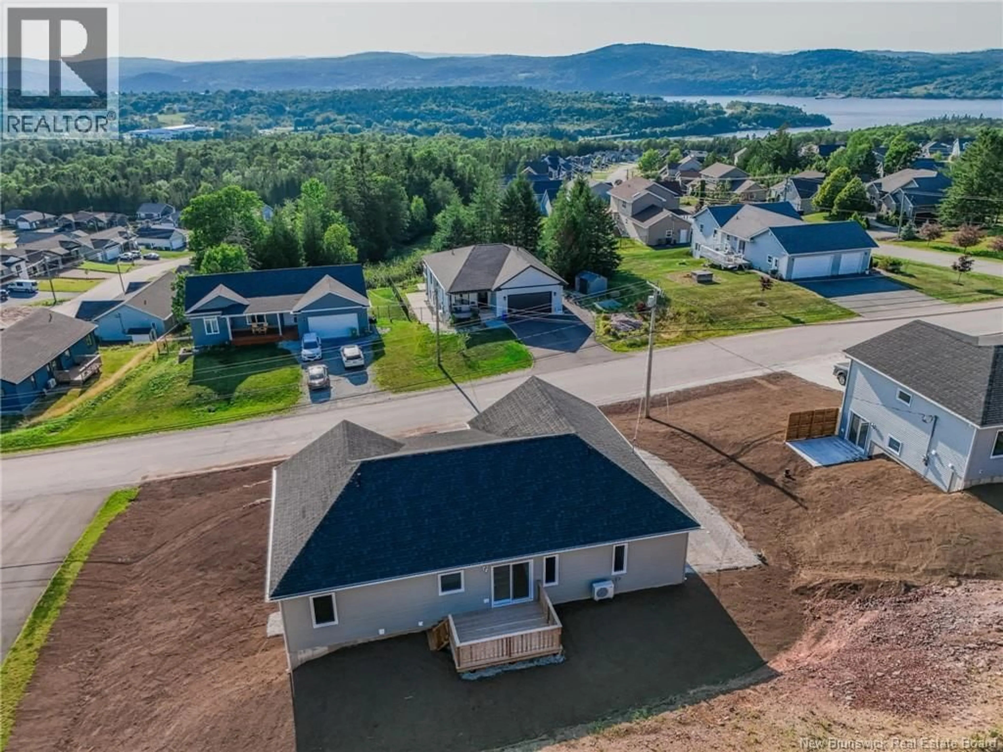 A pic from outside/outdoor area/front of a property/back of a property/a pic from drone, water/lake/river/ocean view for 72 SQUIRE DRIVE, Quispamsis New Brunswick E2G1C1