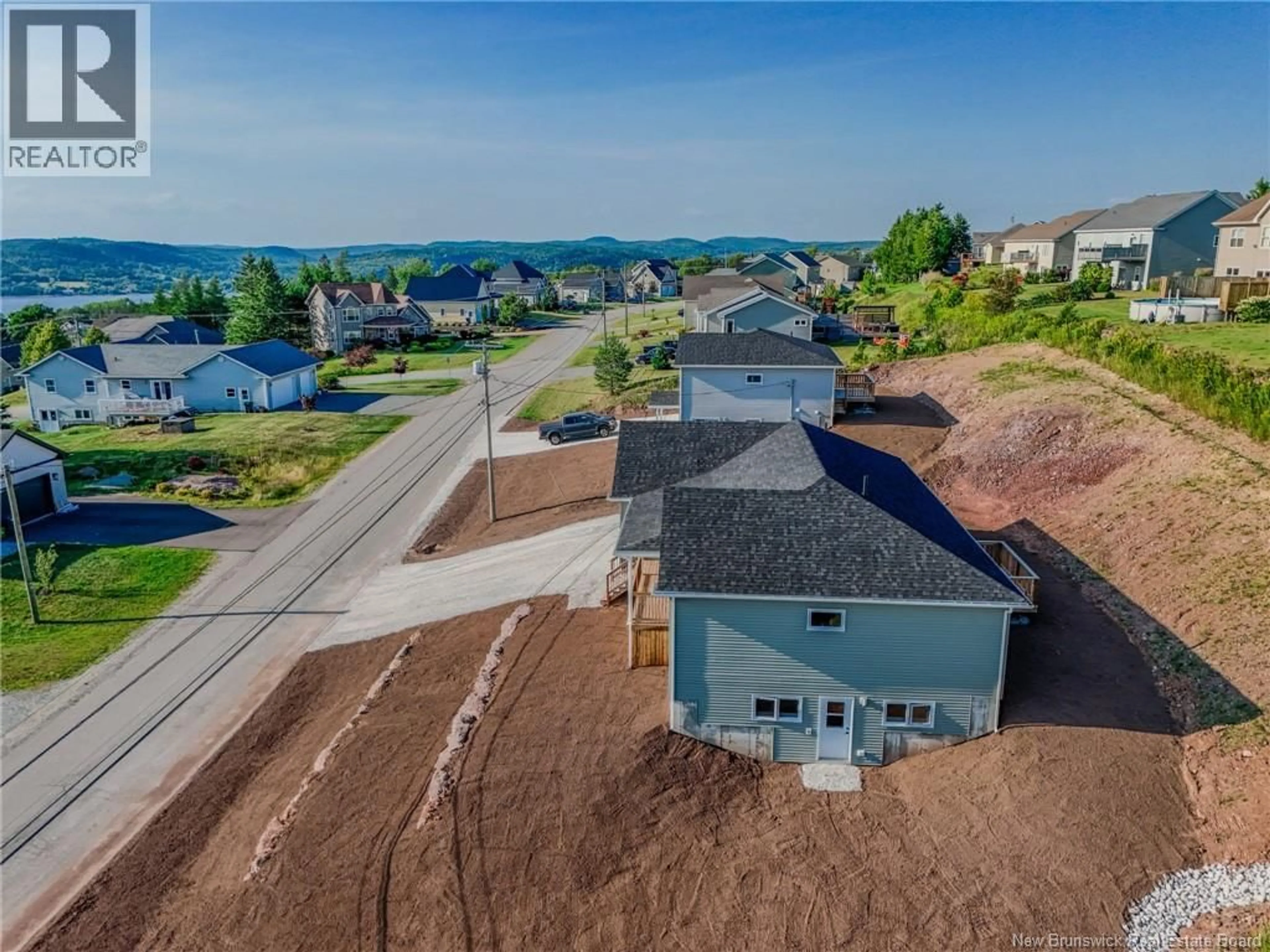 A pic from outside/outdoor area/front of a property/back of a property/a pic from drone, unknown for 72 SQUIRE DRIVE, Quispamsis New Brunswick E2G1C1
