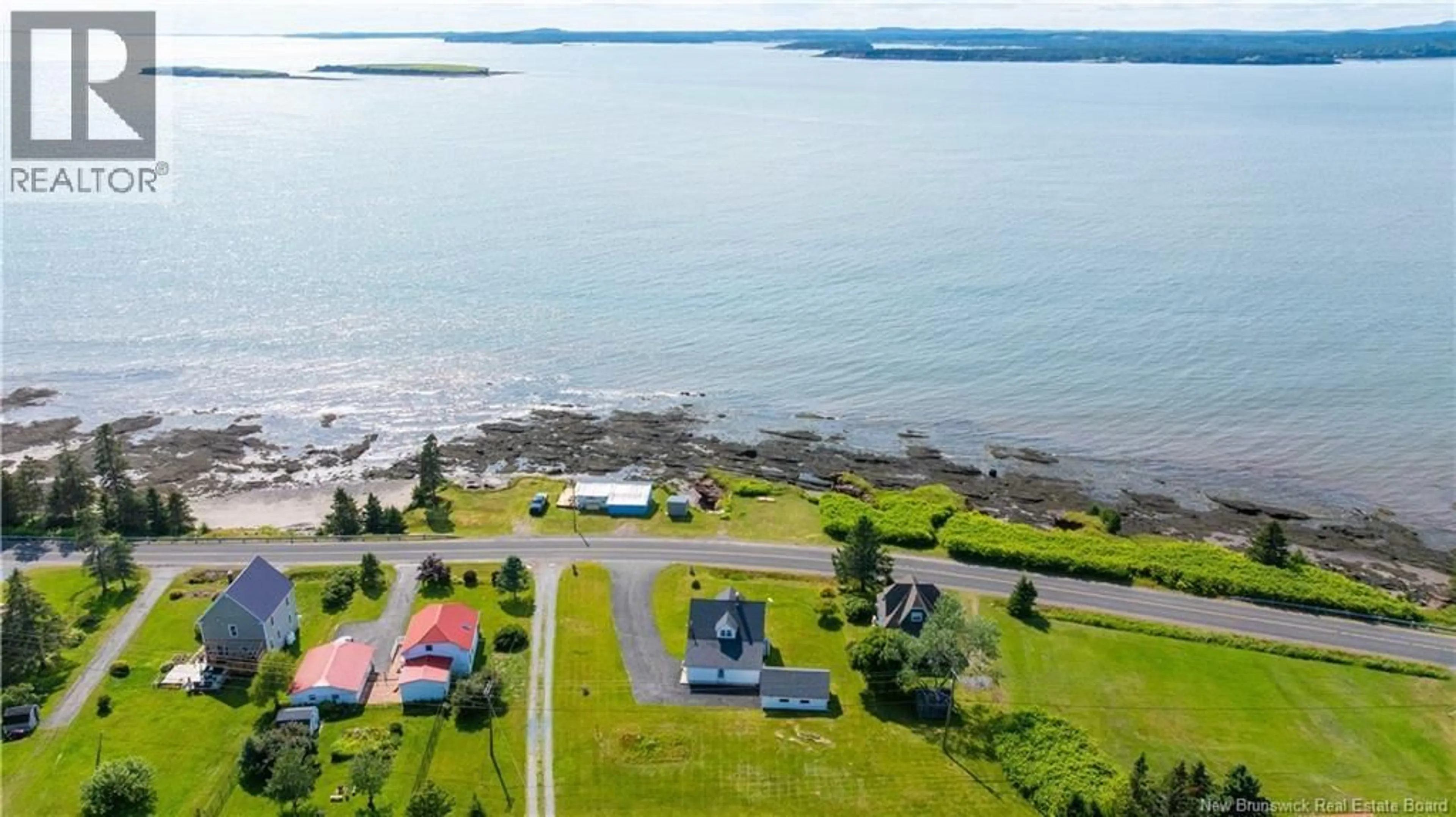 A pic from outside/outdoor area/front of a property/back of a property/a pic from drone, water/lake/river/ocean view for 243 MACES BAY ROAD, Maces Bay New Brunswick E5J1S8