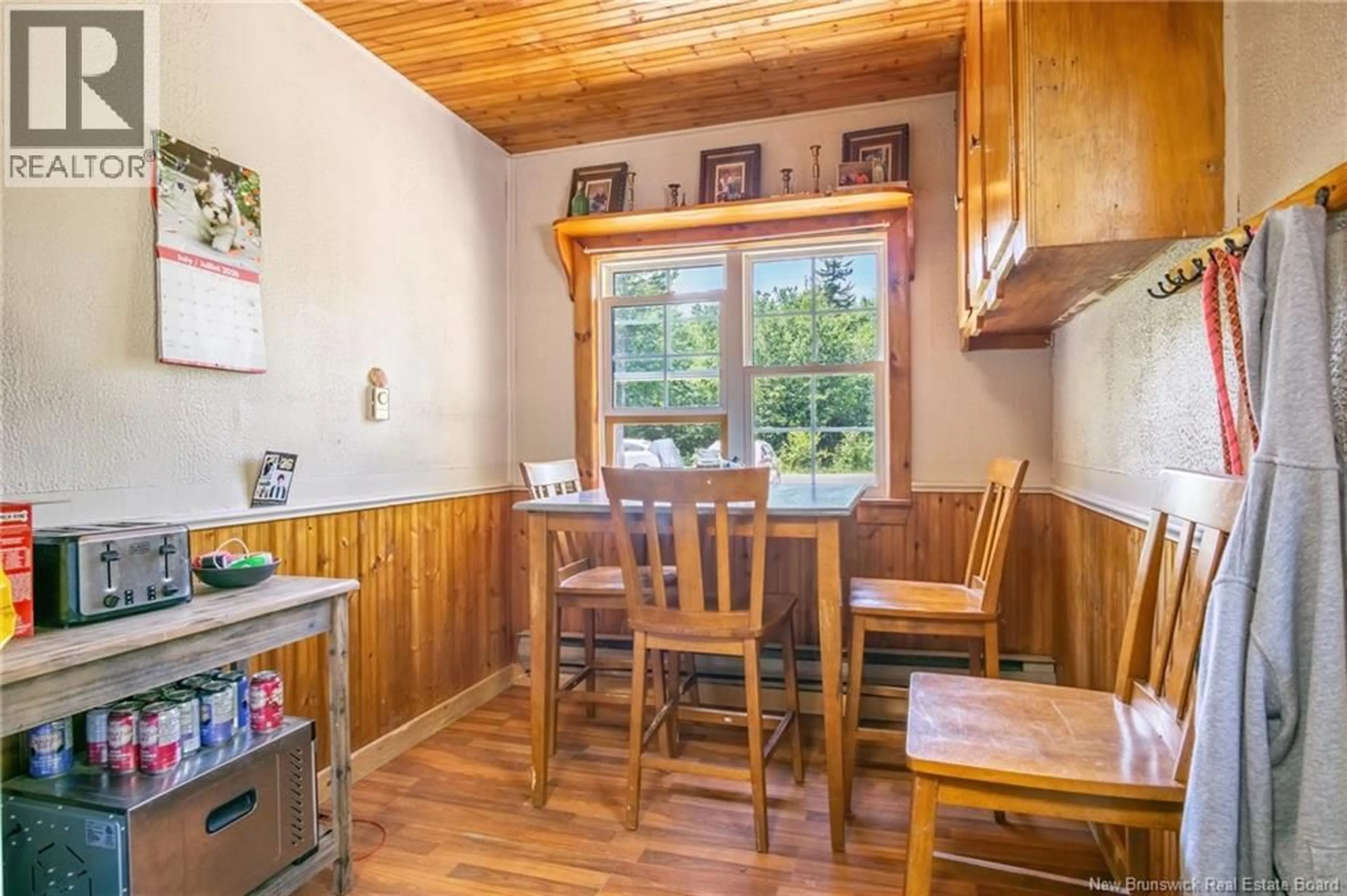 Dining room, wood/laminate floor for 71 SCHOONER COVE ROAD, Wilsons Beach New Brunswick E5E1N2