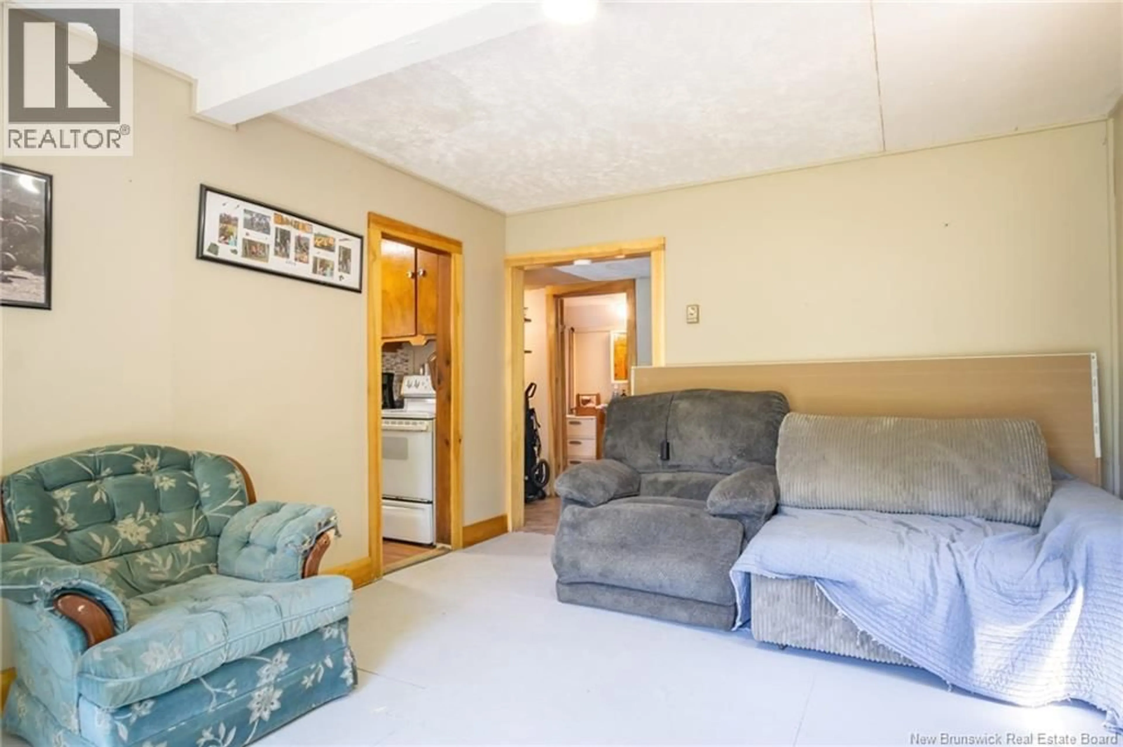 Living room with furniture, unknown for 71 SCHOONER COVE ROAD, Wilsons Beach New Brunswick E5E1N2