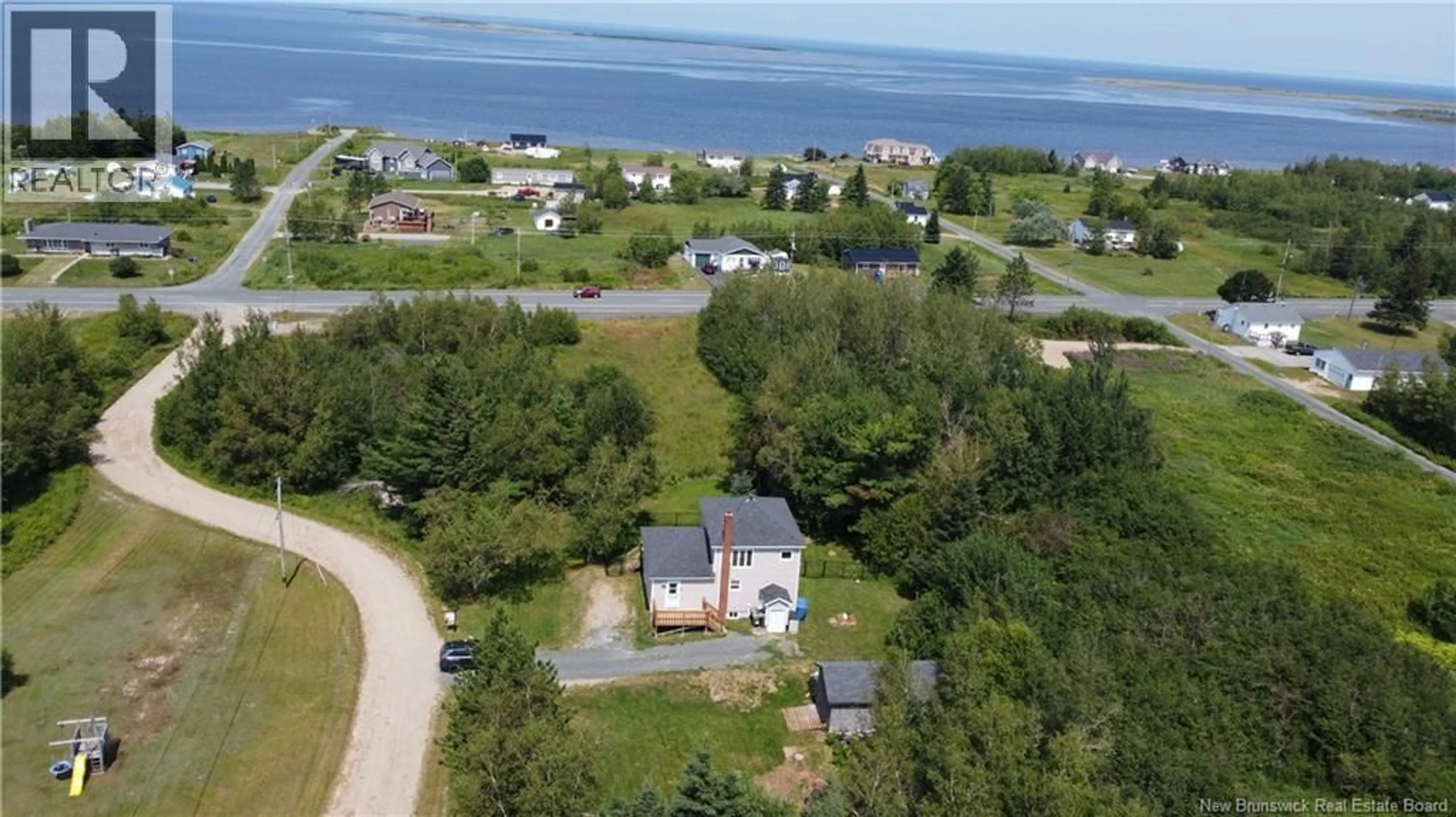 A pic from outside/outdoor area/front of a property/back of a property/a pic from drone, water/lake/river/ocean view for 9 BAYVIEW SOUTH ROAD, Baie-Sainte-Anne New Brunswick E9A1A5
