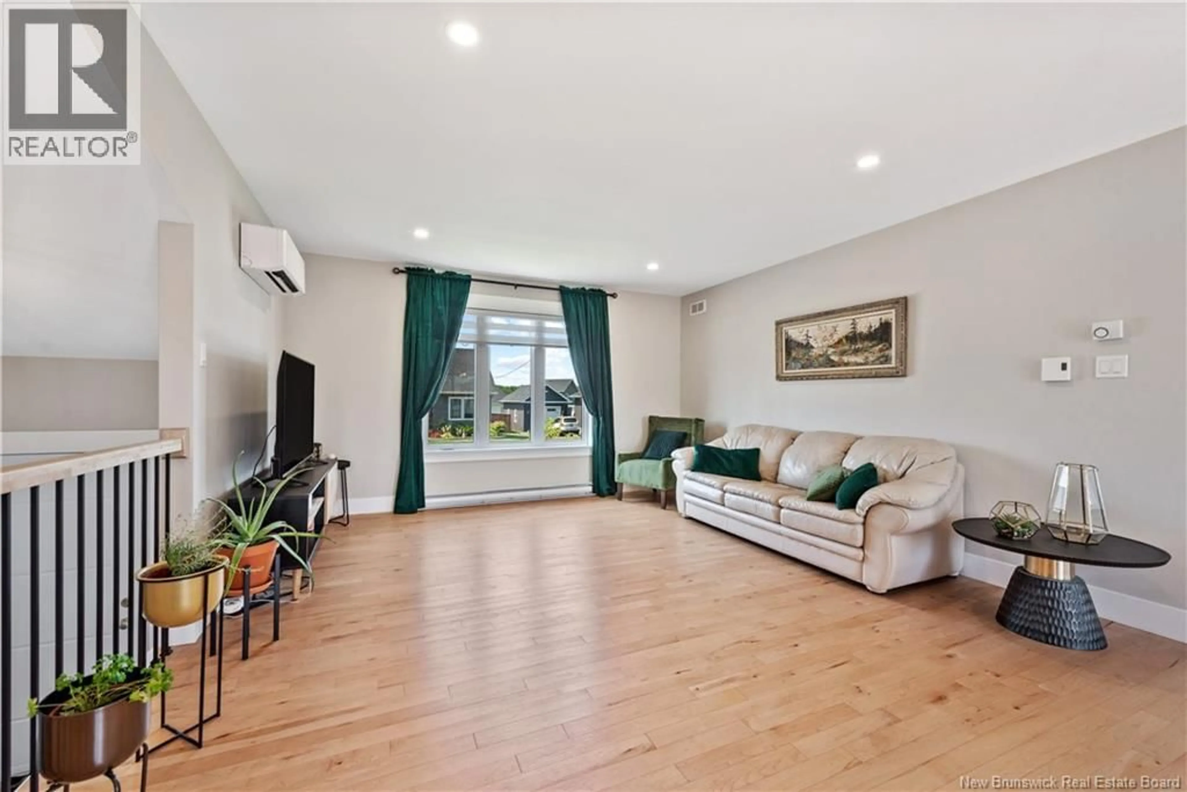 Living room with furniture, wood/laminate floor for 14 ROBERT STREET, Shediac New Brunswick E4P0R2