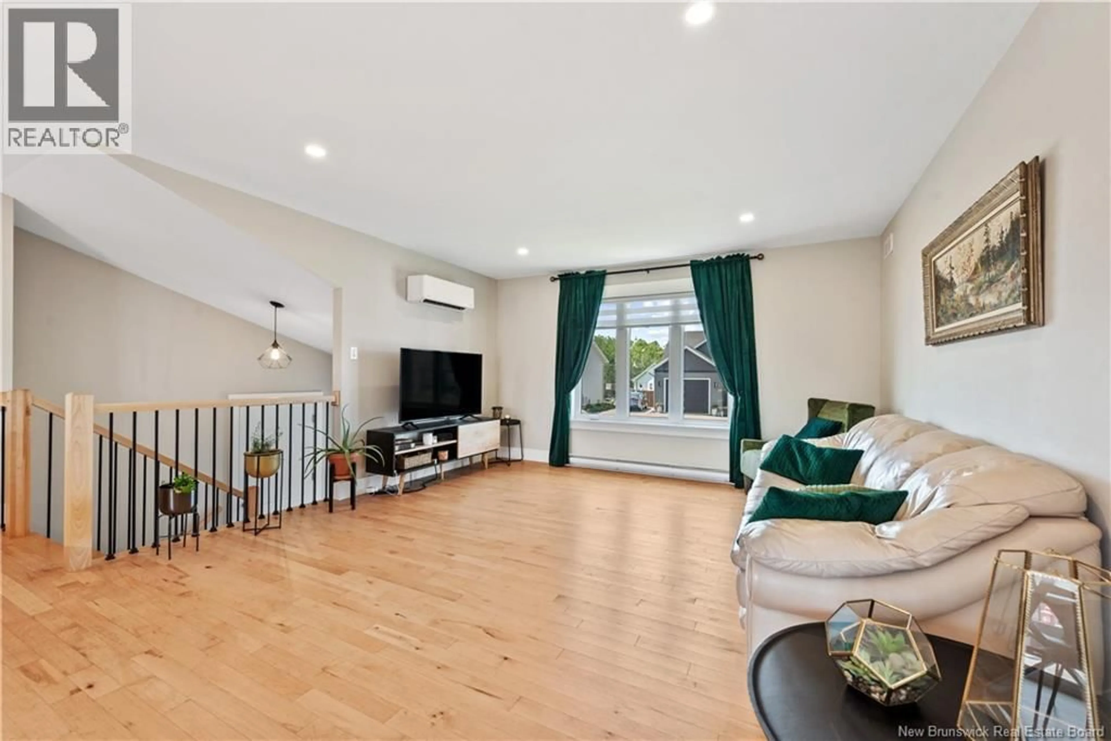 Living room with furniture, wood/laminate floor for 14 ROBERT STREET, Shediac New Brunswick E4P0R2