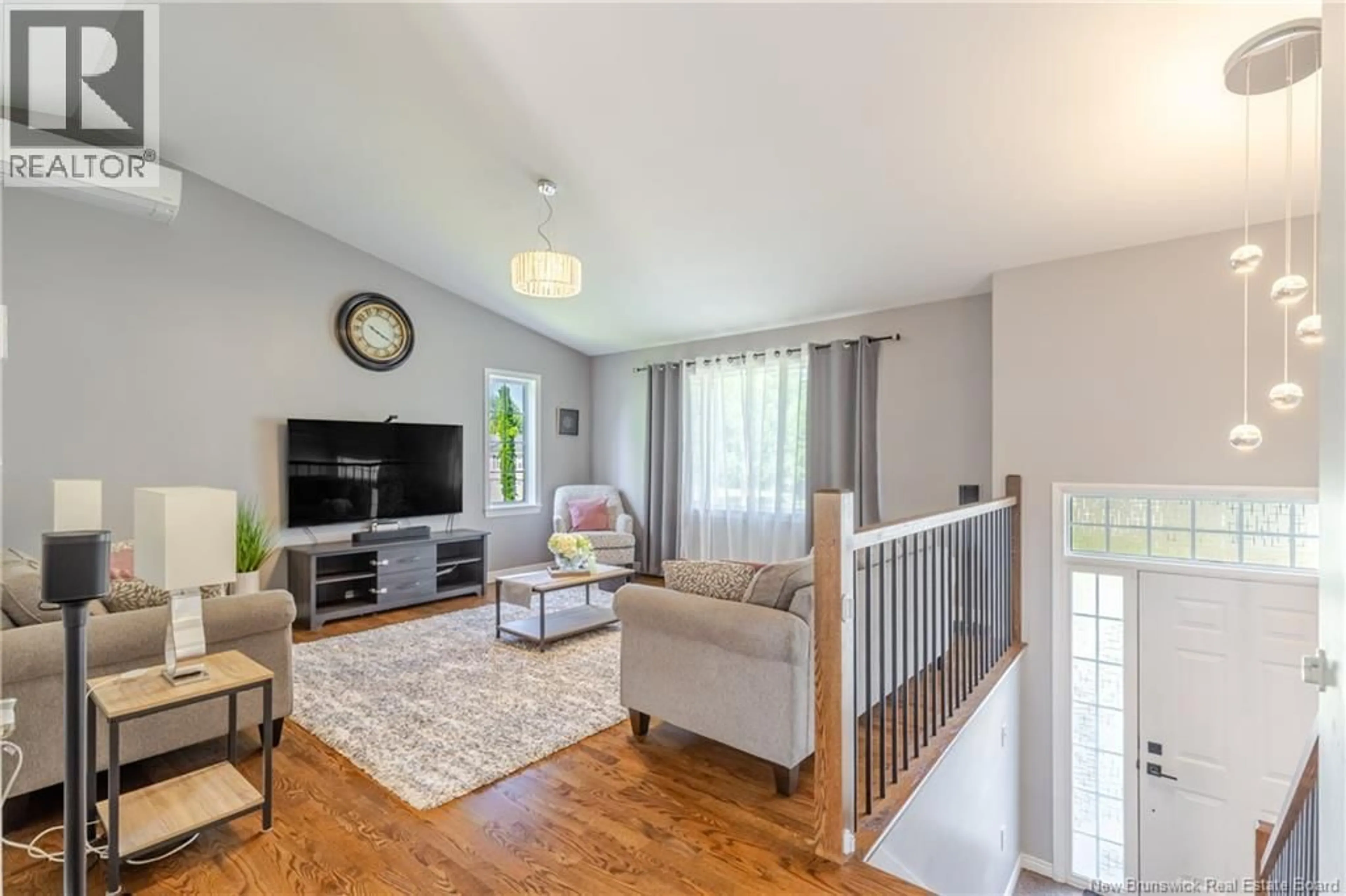Living room with furniture, wood/laminate floor for 86 REBECCA DRIVE, Fredericton New Brunswick E3B9N4