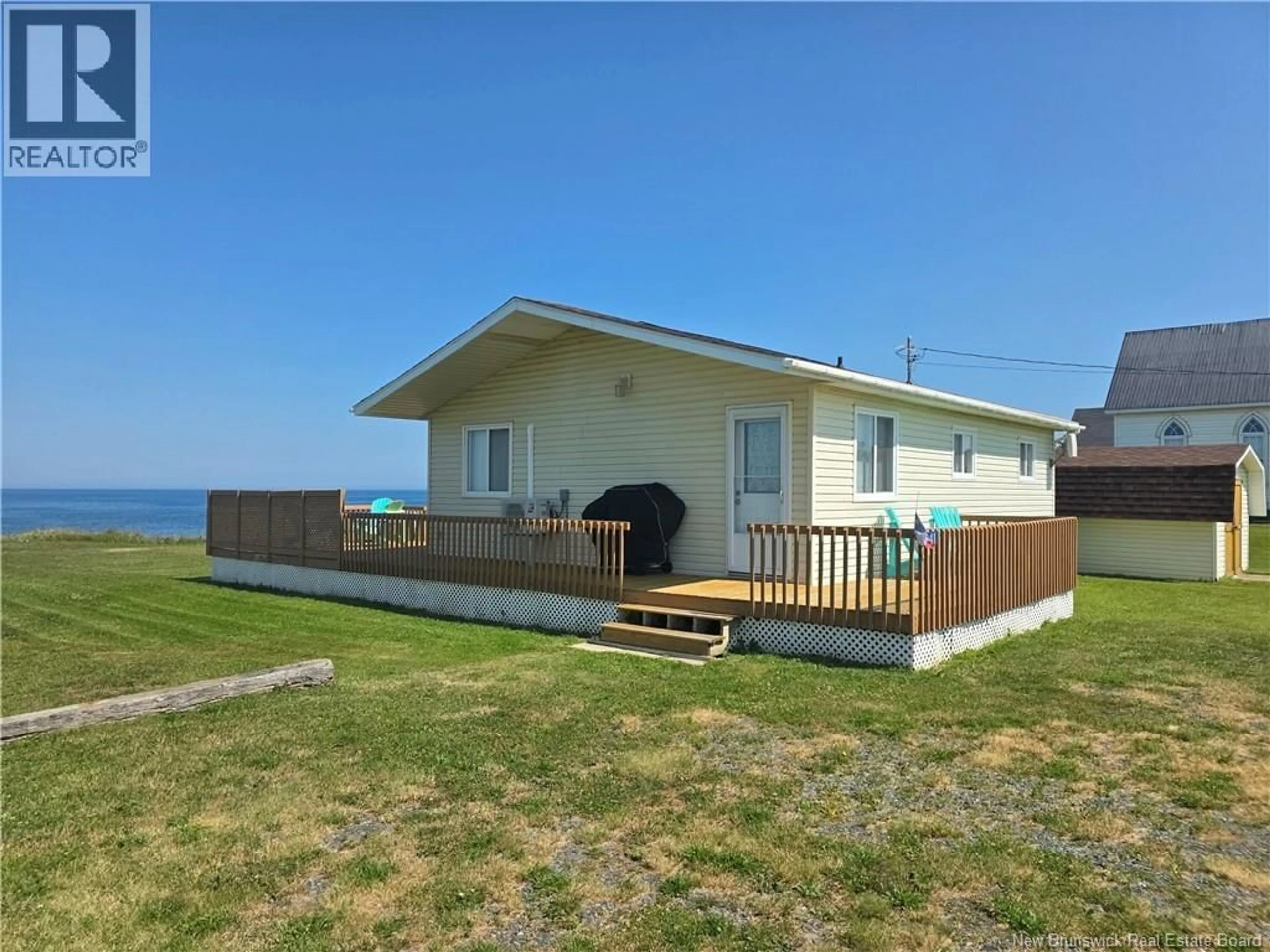 A pic from outside/outdoor area/front of a property/back of a property/a pic from drone, water/lake/river/ocean view for 5941 RTE 11, Janeville New Brunswick E2A5L1