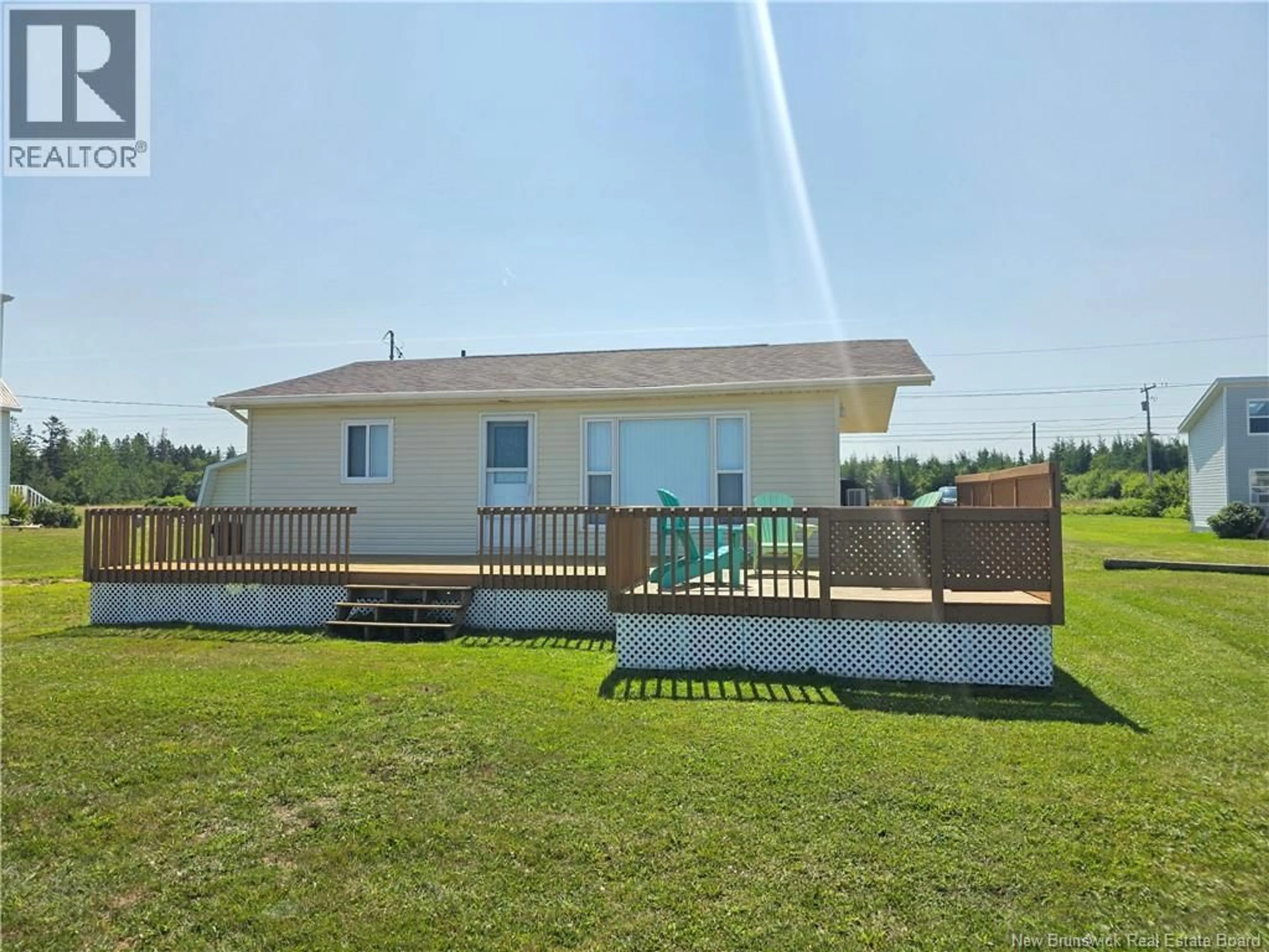 A pic from outside/outdoor area/front of a property/back of a property/a pic from drone, water/lake/river/ocean view for 5941 RTE 11, Janeville New Brunswick E2A5L1