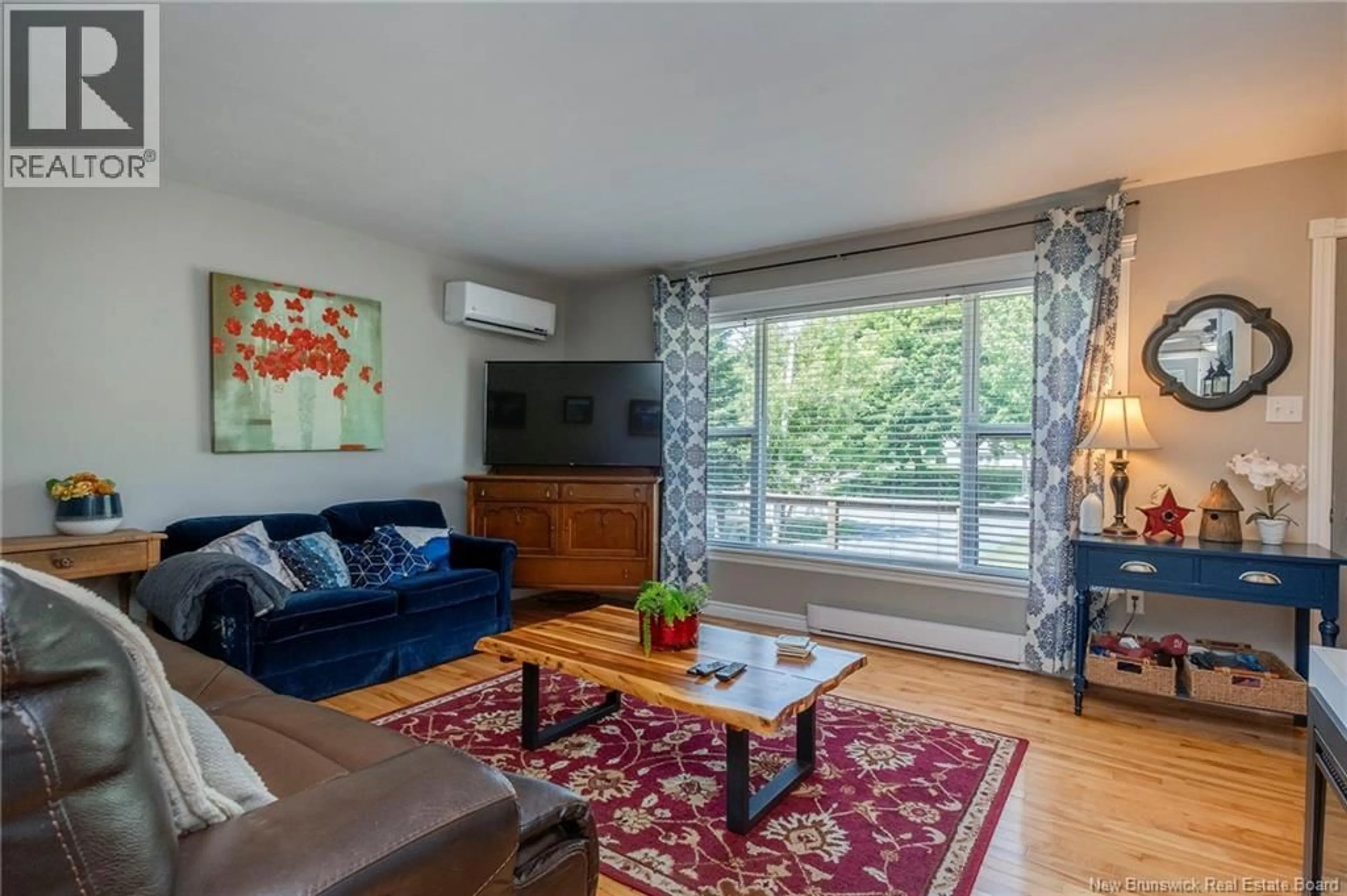 Living room with furniture, wood/laminate floor for 28 LOYALIST DRIVE, Hampton New Brunswick E5N5V6
