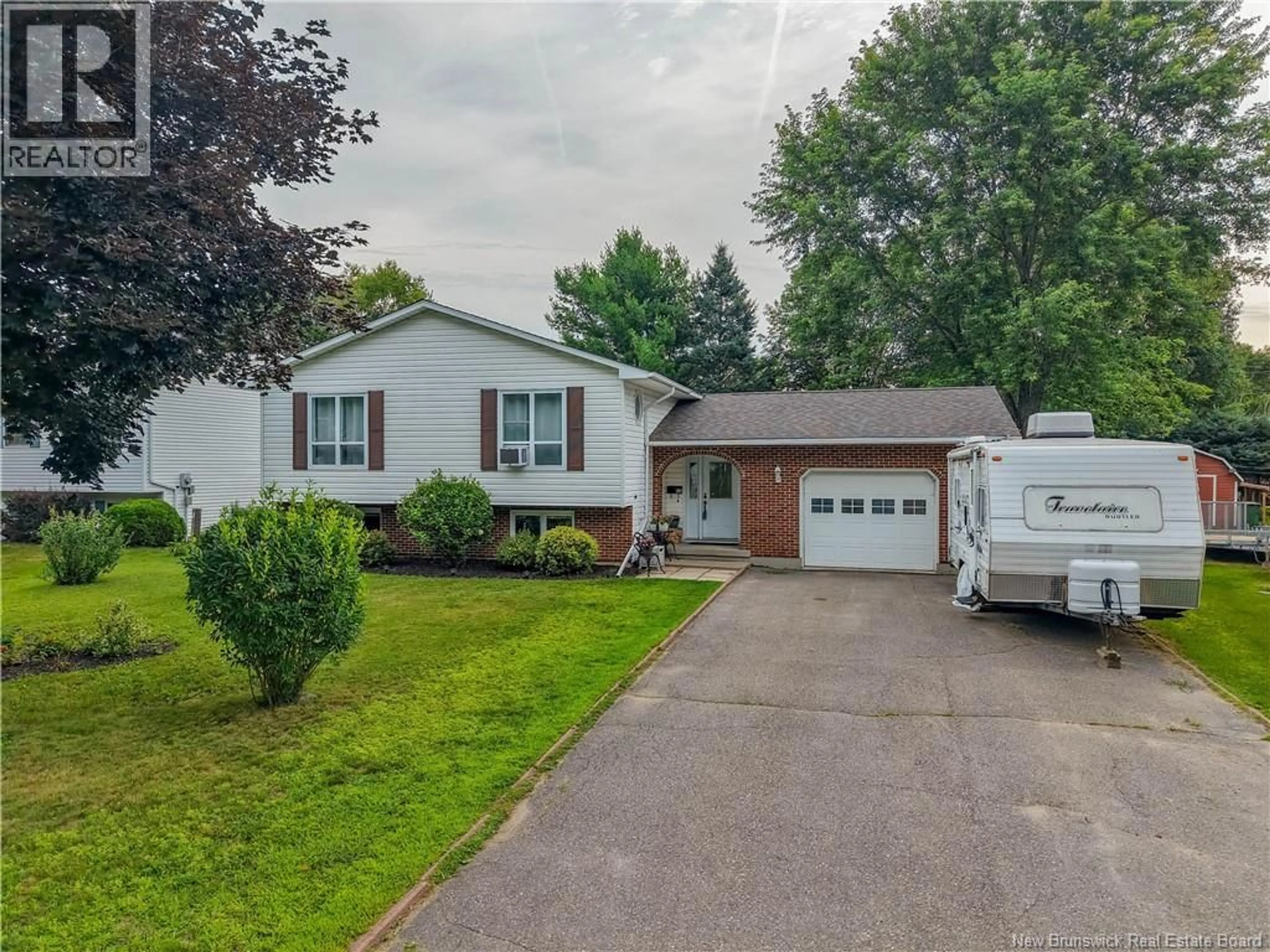 Home with vinyl exterior material, street for 52 DRAMMEN DRIVE, Fredericton New Brunswick E3A5S2