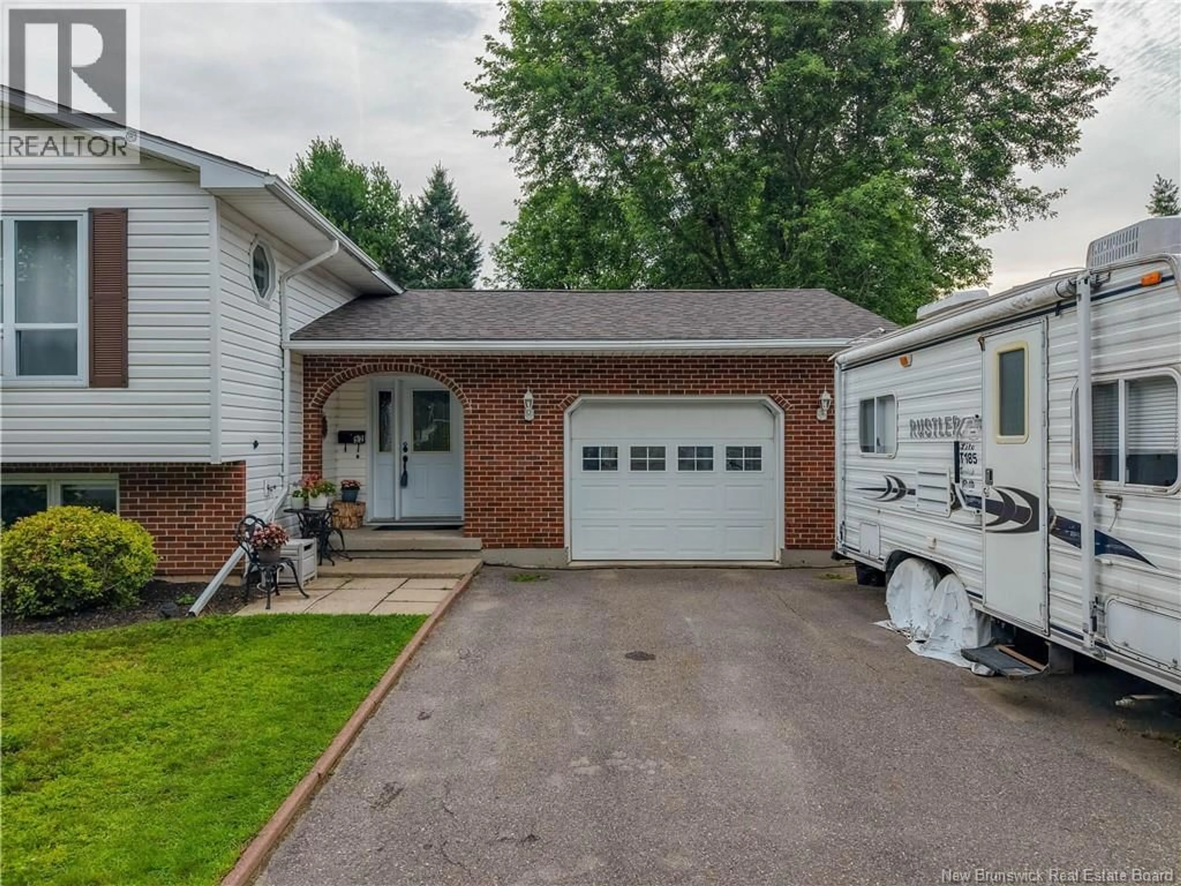 Home with vinyl exterior material, street for 52 DRAMMEN DRIVE, Fredericton New Brunswick E3A5S2