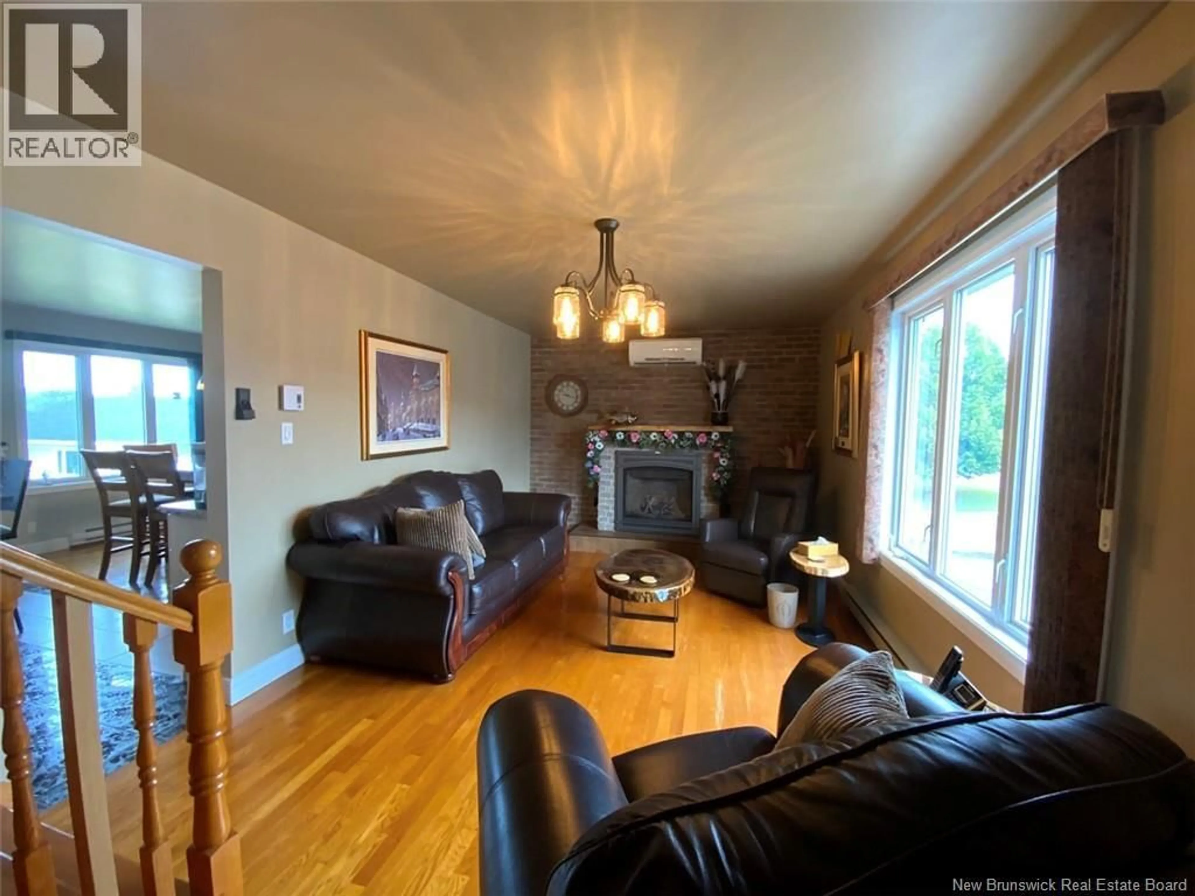 Living room with furniture, wood/laminate floor for 134 PRINCIPALE STREET, Sainte-Anne-De-Madawaska New Brunswick E7E0C4