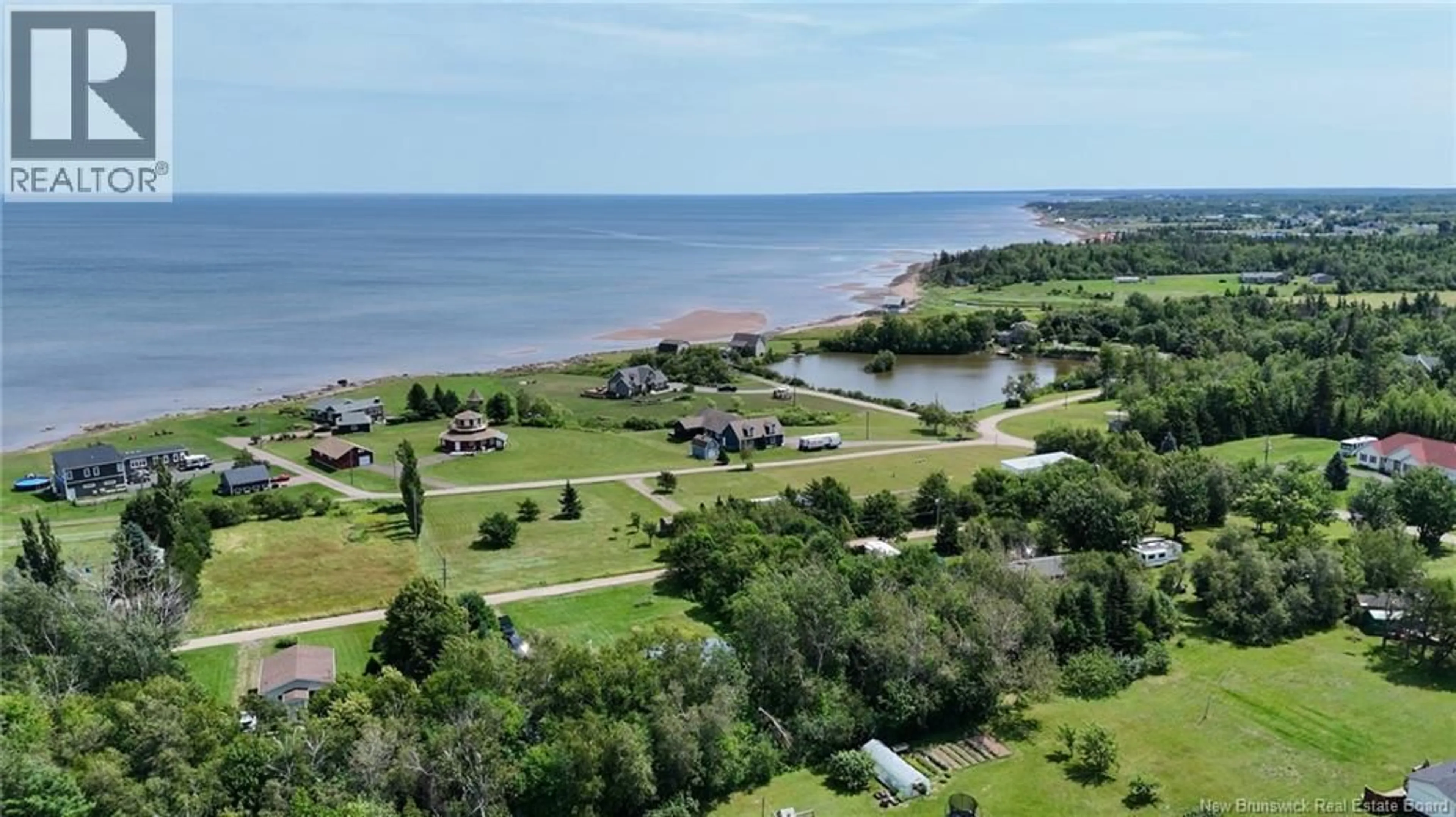A pic from outside/outdoor area/front of a property/back of a property/a pic from drone, water/lake/river/ocean view for 41 ALLEE BORGITTE, Beaubassin East New Brunswick E4N1A3