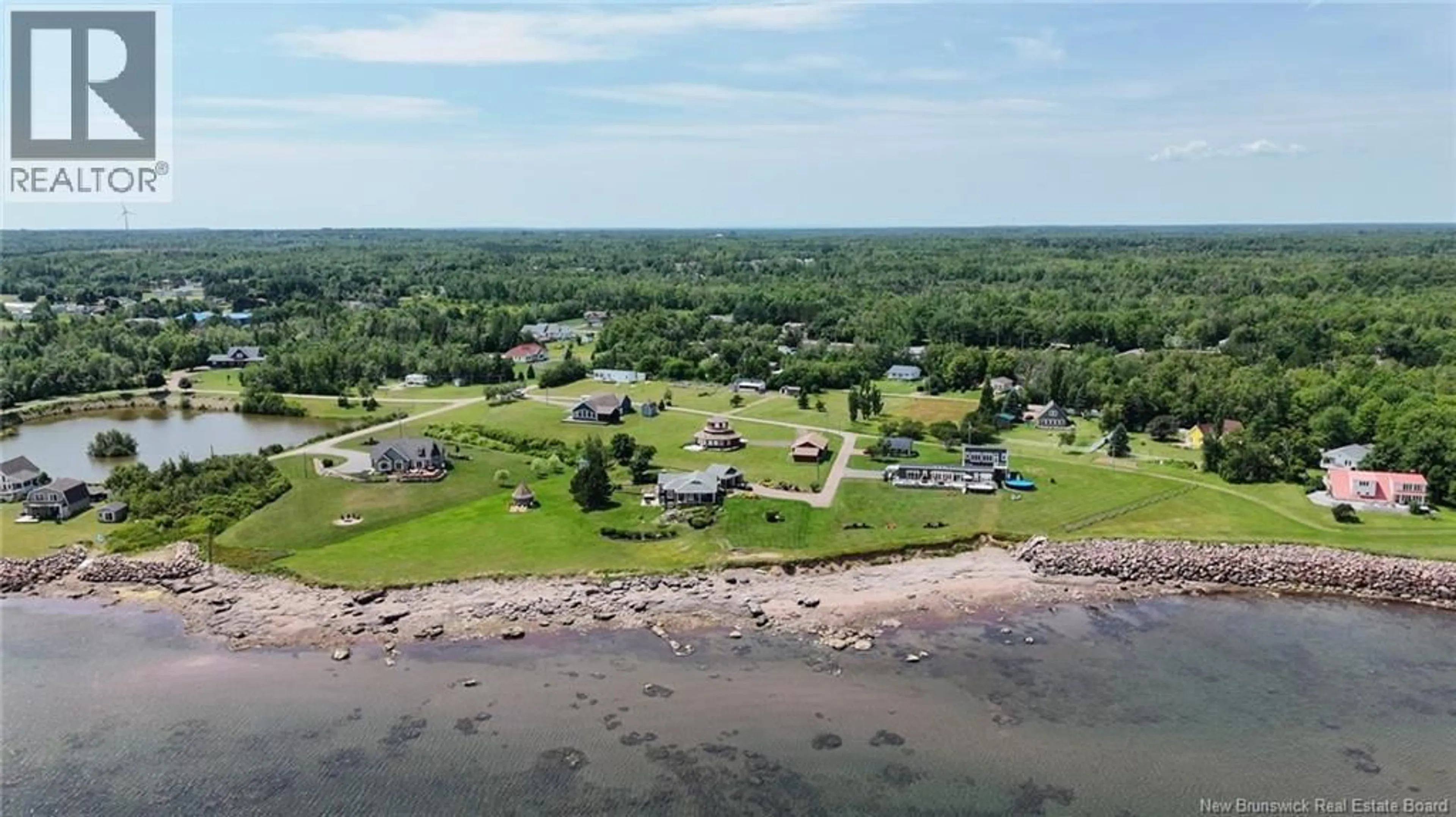A pic from outside/outdoor area/front of a property/back of a property/a pic from drone, water/lake/river/ocean view for 41 ALLEE BORGITTE, Beaubassin East New Brunswick E4N1A3
