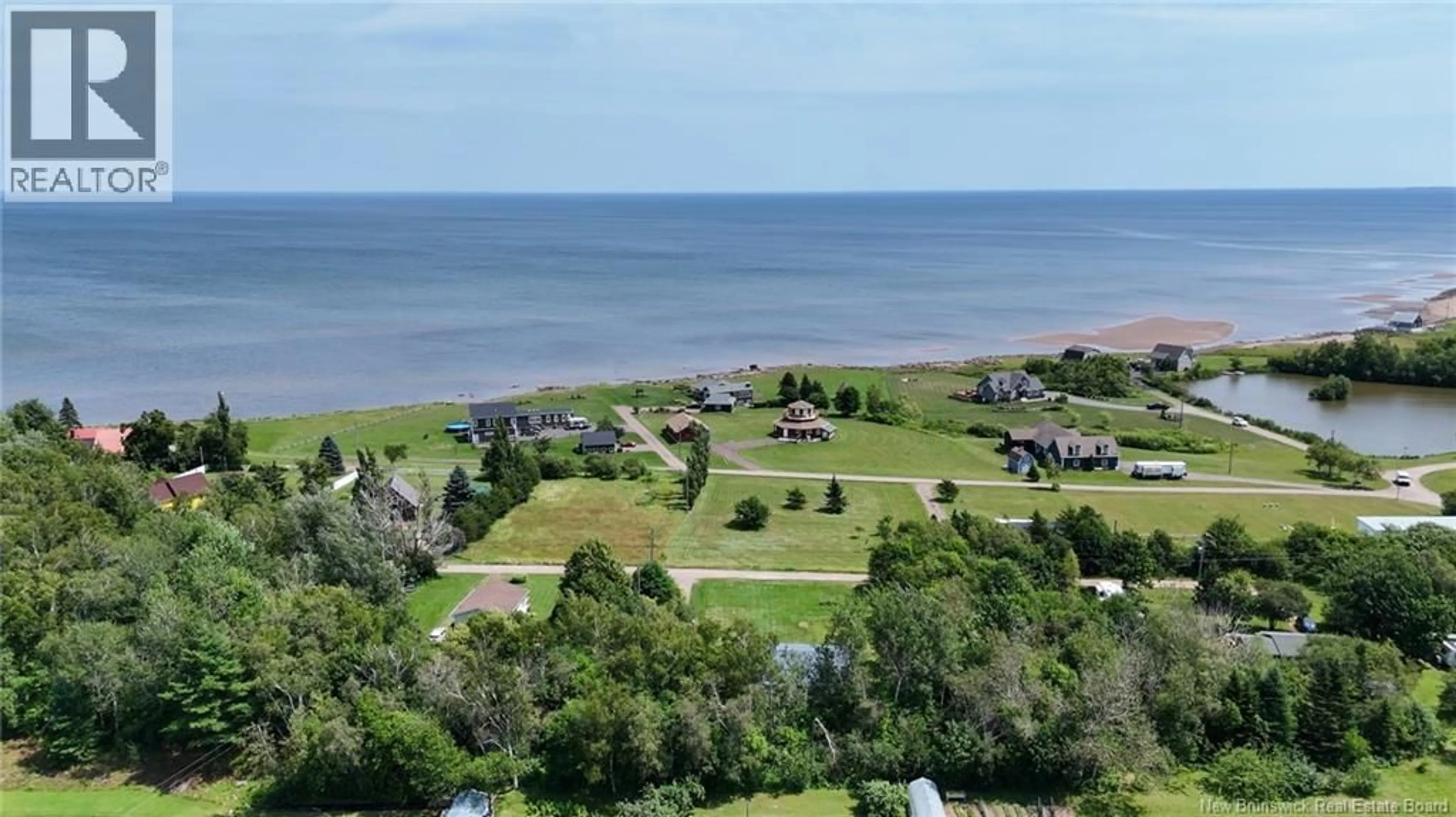 A pic from outside/outdoor area/front of a property/back of a property/a pic from drone, water/lake/river/ocean view for 41 ALLEE BORGITTE, Beaubassin East New Brunswick E4N1A3