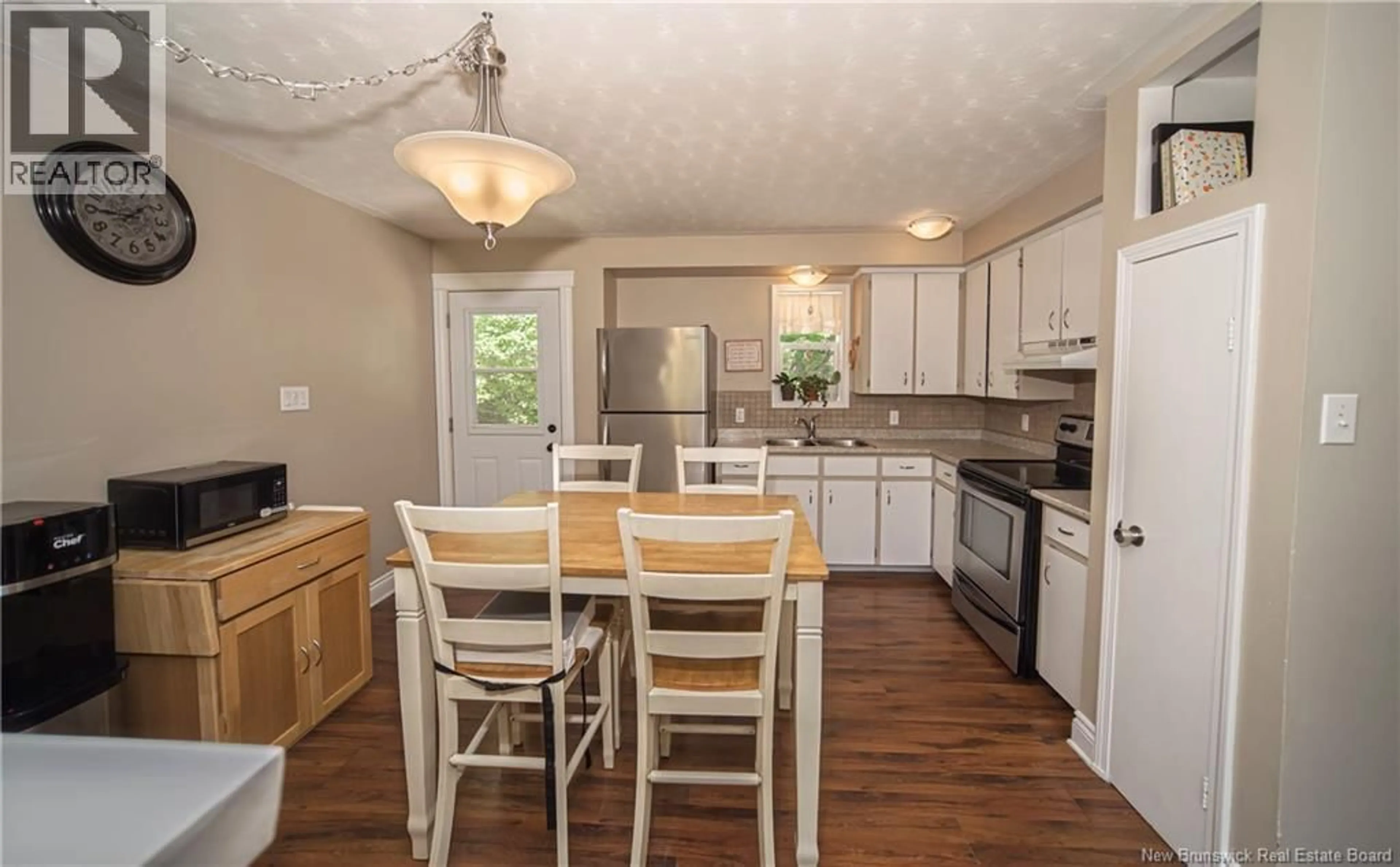 Open concept kitchen, wood/laminate floor for 51 CARR STREET, Geary New Brunswick E2V4C1