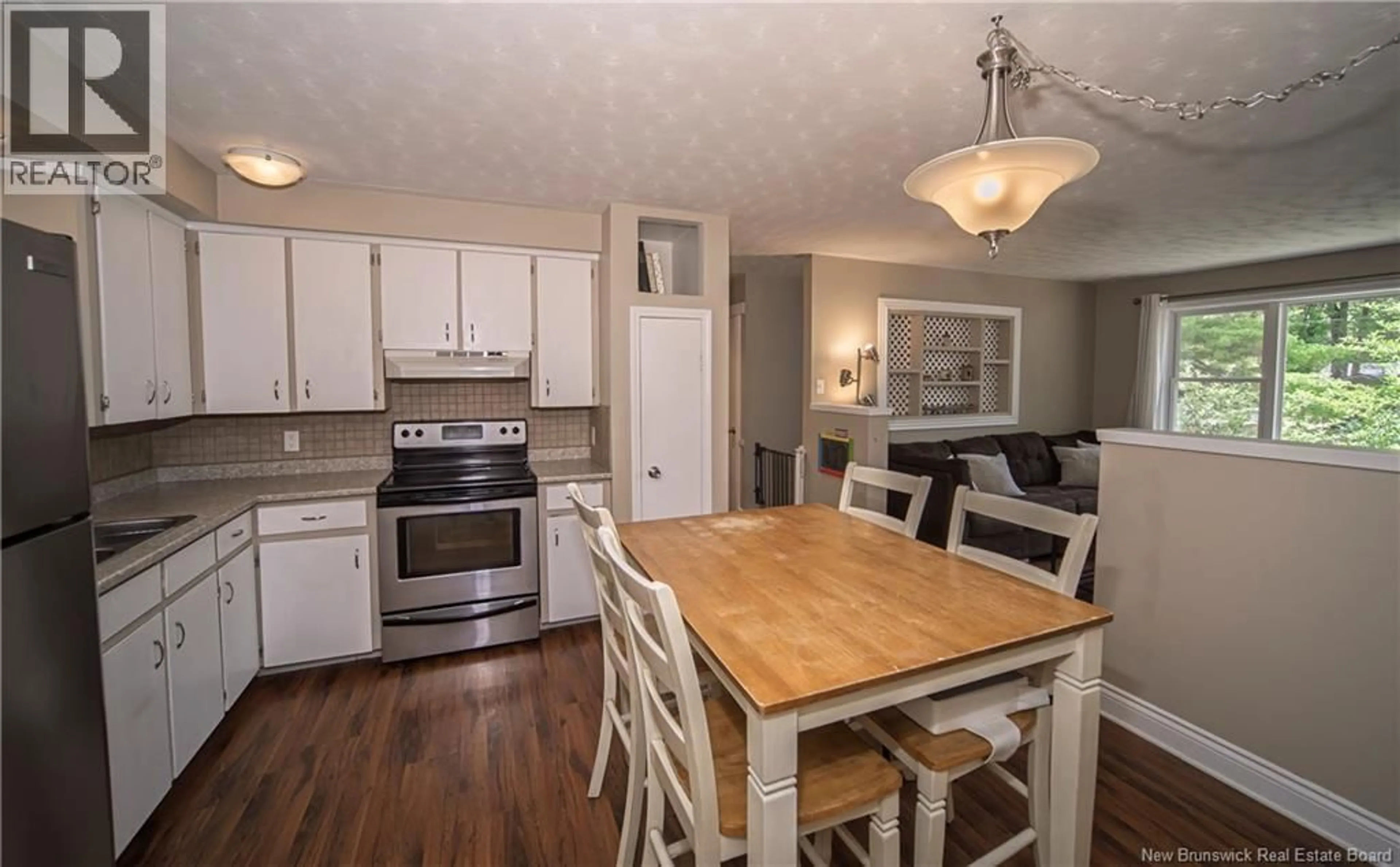 Open concept kitchen, wood/laminate floor for 51 CARR STREET, Geary New Brunswick E2V4C1