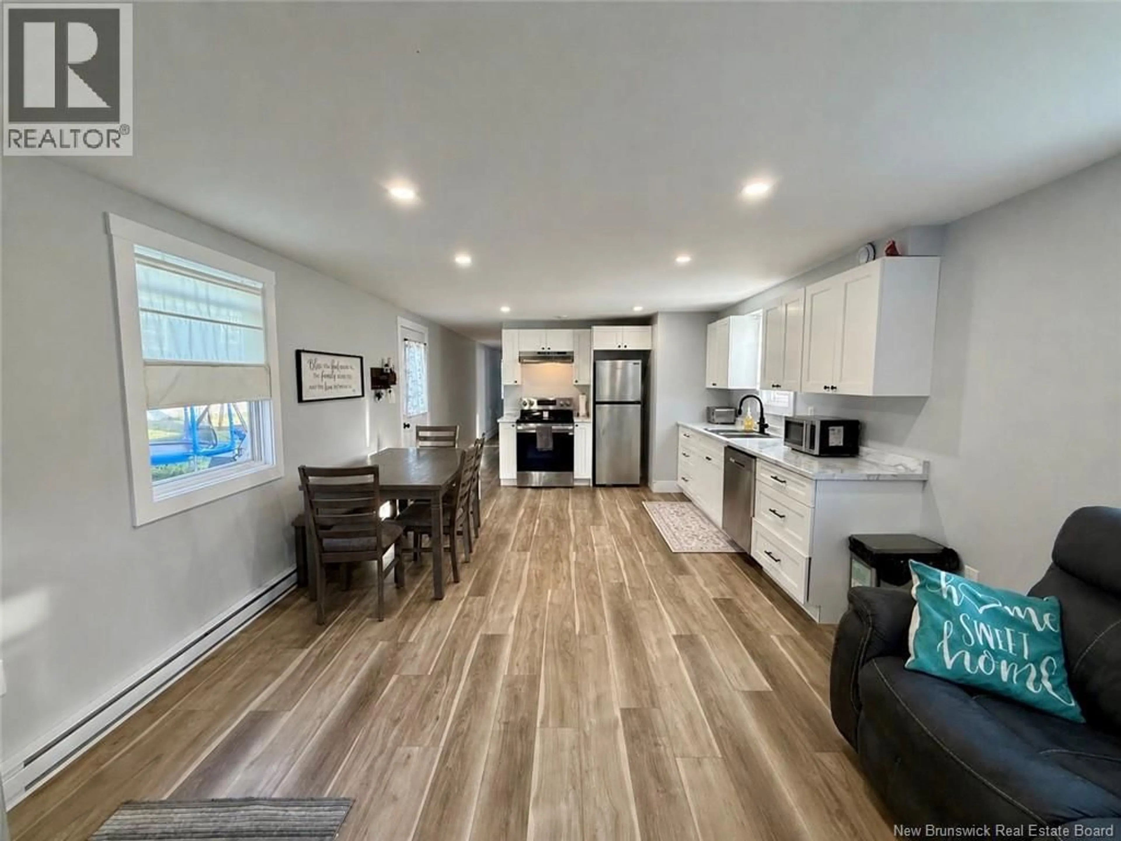 Open concept kitchen, wood/laminate floor for 182 LOGIE DRIVE, Hampton New Brunswick E5N5T5