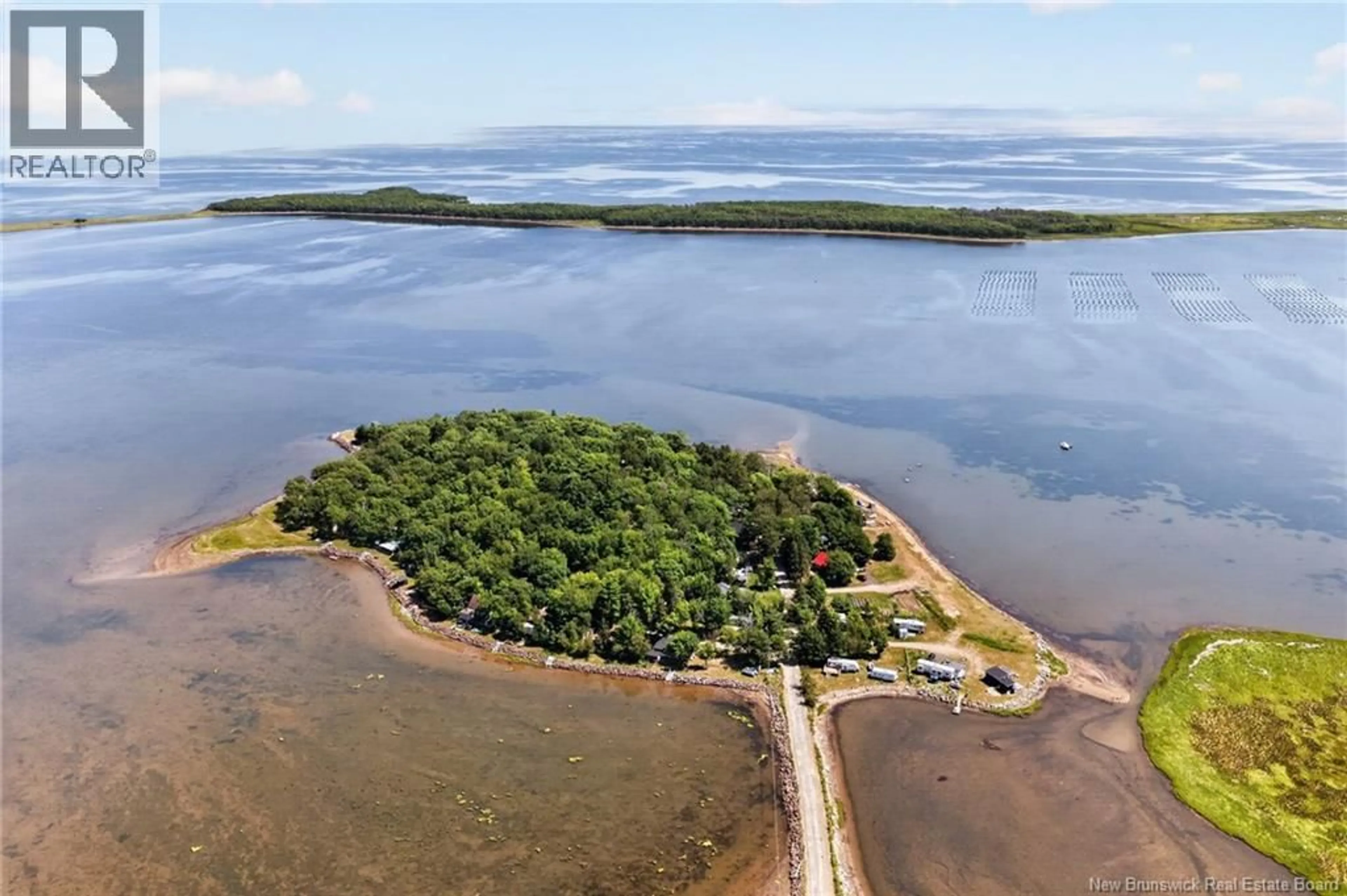 A pic from outside/outdoor area/front of a property/back of a property/a pic from drone, water/lake/river/ocean view for 73 COLPITTS STREET, Cocagne New Brunswick E4R2G7