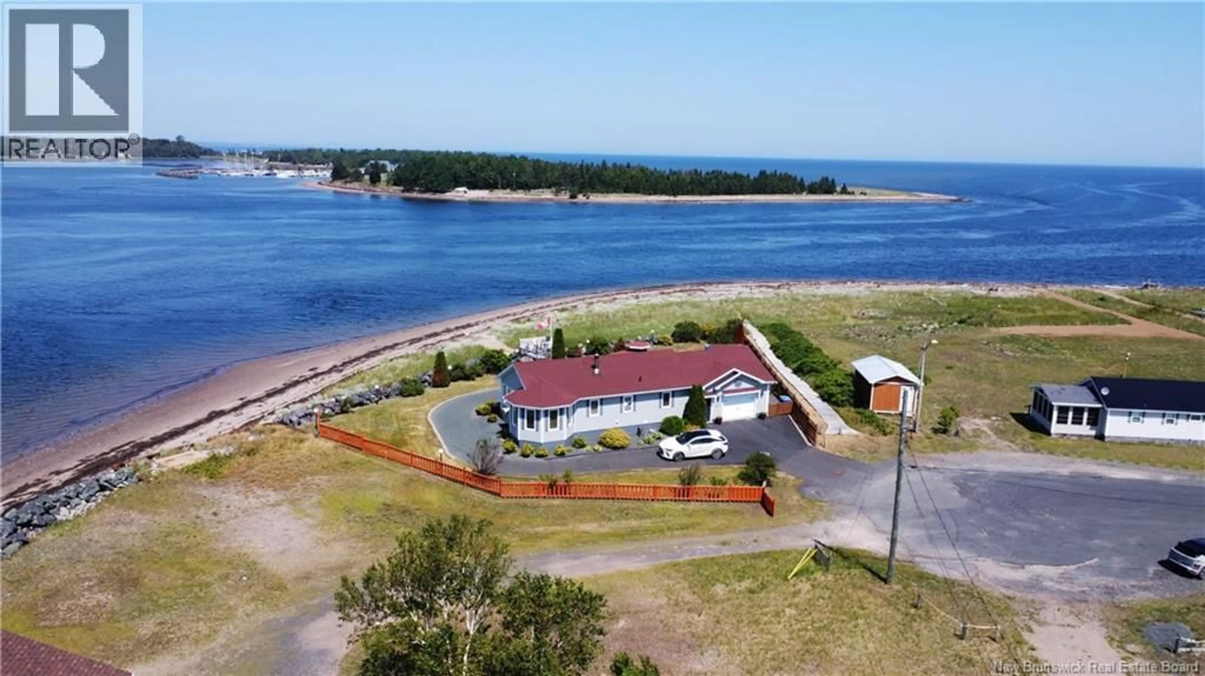 A pic from outside/outdoor area/front of a property/back of a property/a pic from drone, water/lake/river/ocean view for 25 BAYSHORE, Bathurst New Brunswick E2A6A4