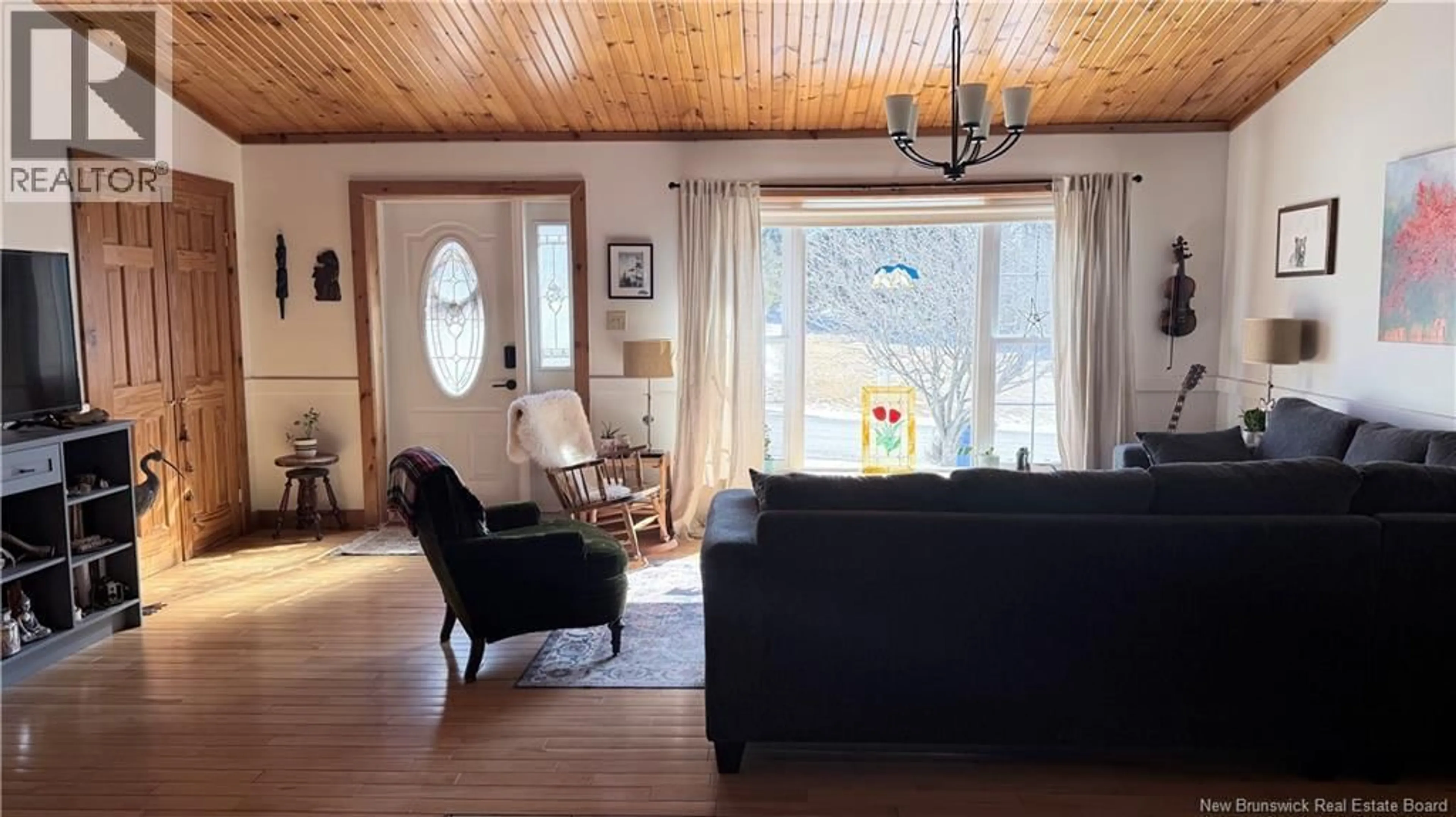 Living room with furniture, wood/laminate floor for 217 BARRETT, Perth-Andover New Brunswick E7H1E1