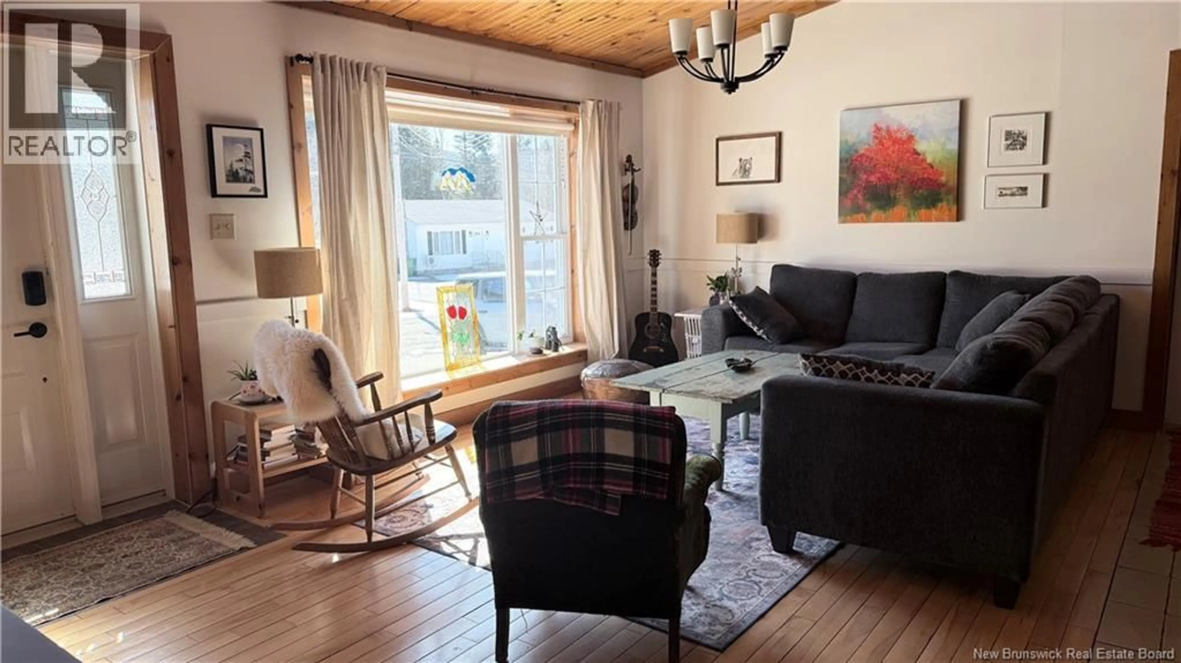 Living room with furniture, wood/laminate floor for 217 BARRETT, Perth-Andover New Brunswick E7H1E1
