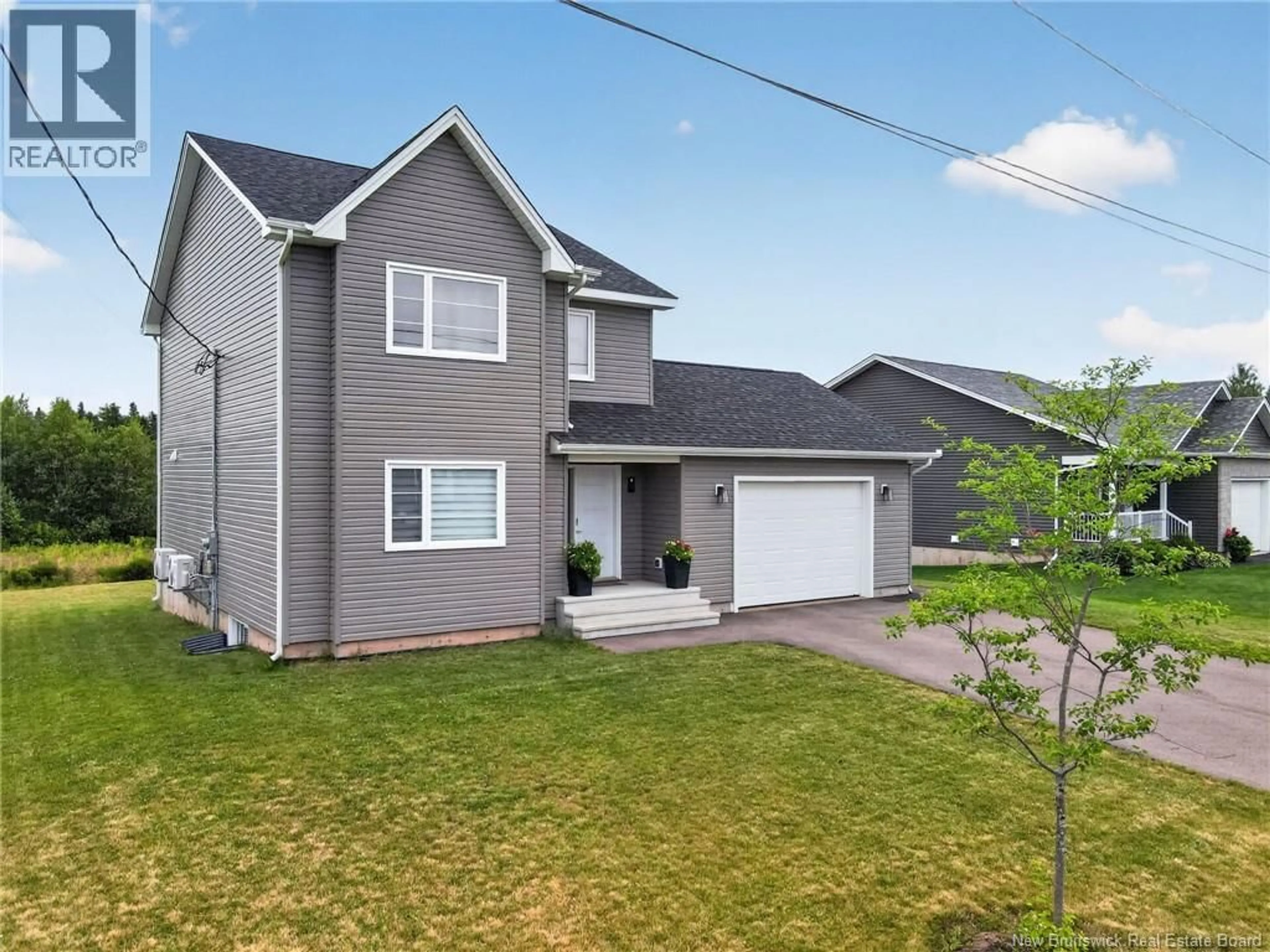 Home with vinyl exterior material, street for 32 LUXOR DRIVE, Riverview New Brunswick E1B0V8