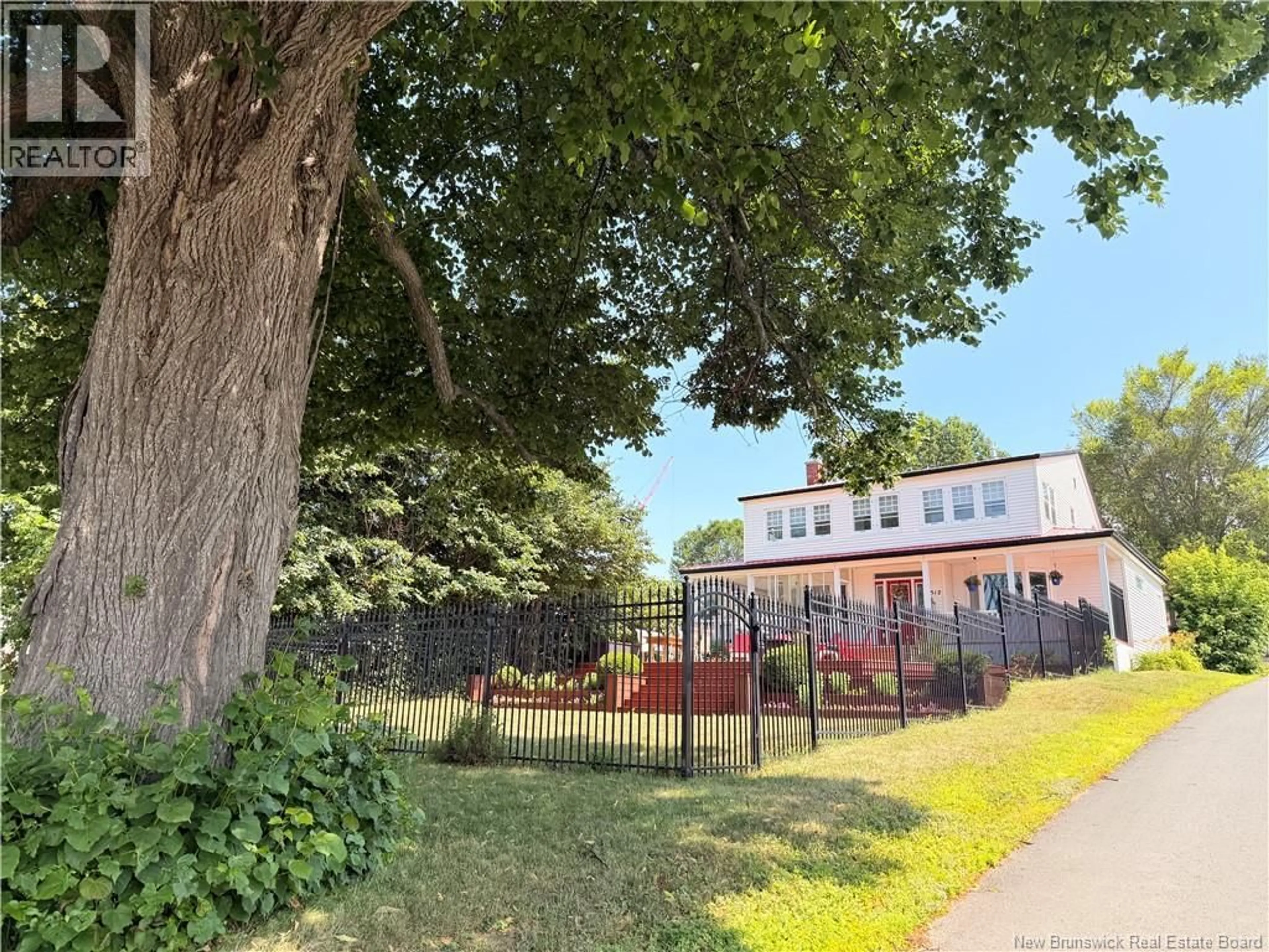 A pic from outside/outdoor area/front of a property/back of a property/a pic from drone, unknown for 1512 WATER STREET, Miramichi New Brunswick E1N1A6