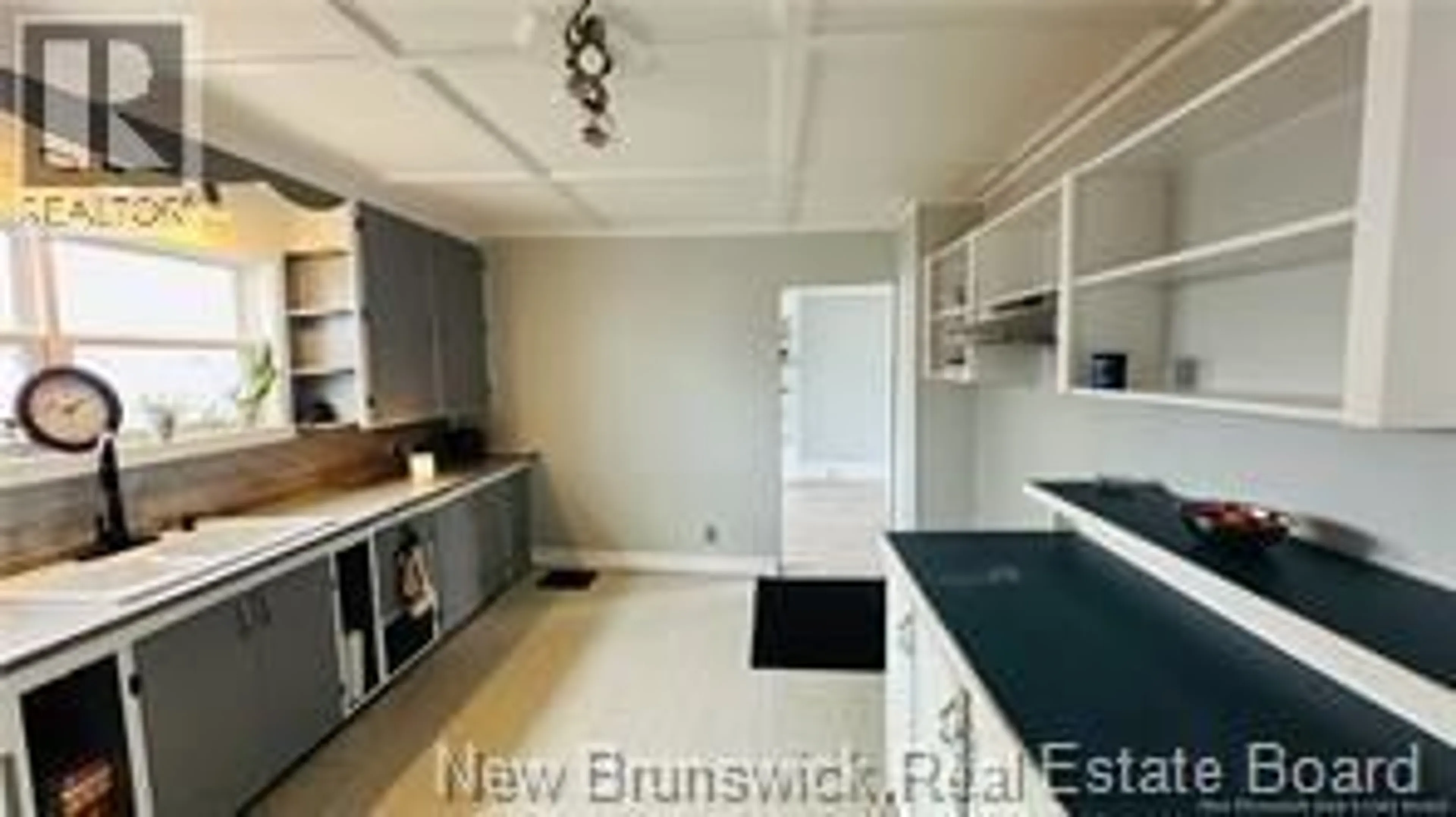 Open concept kitchen, wood/laminate floor for 148 UNION STREET, Woodstock New Brunswick E7M2C1
