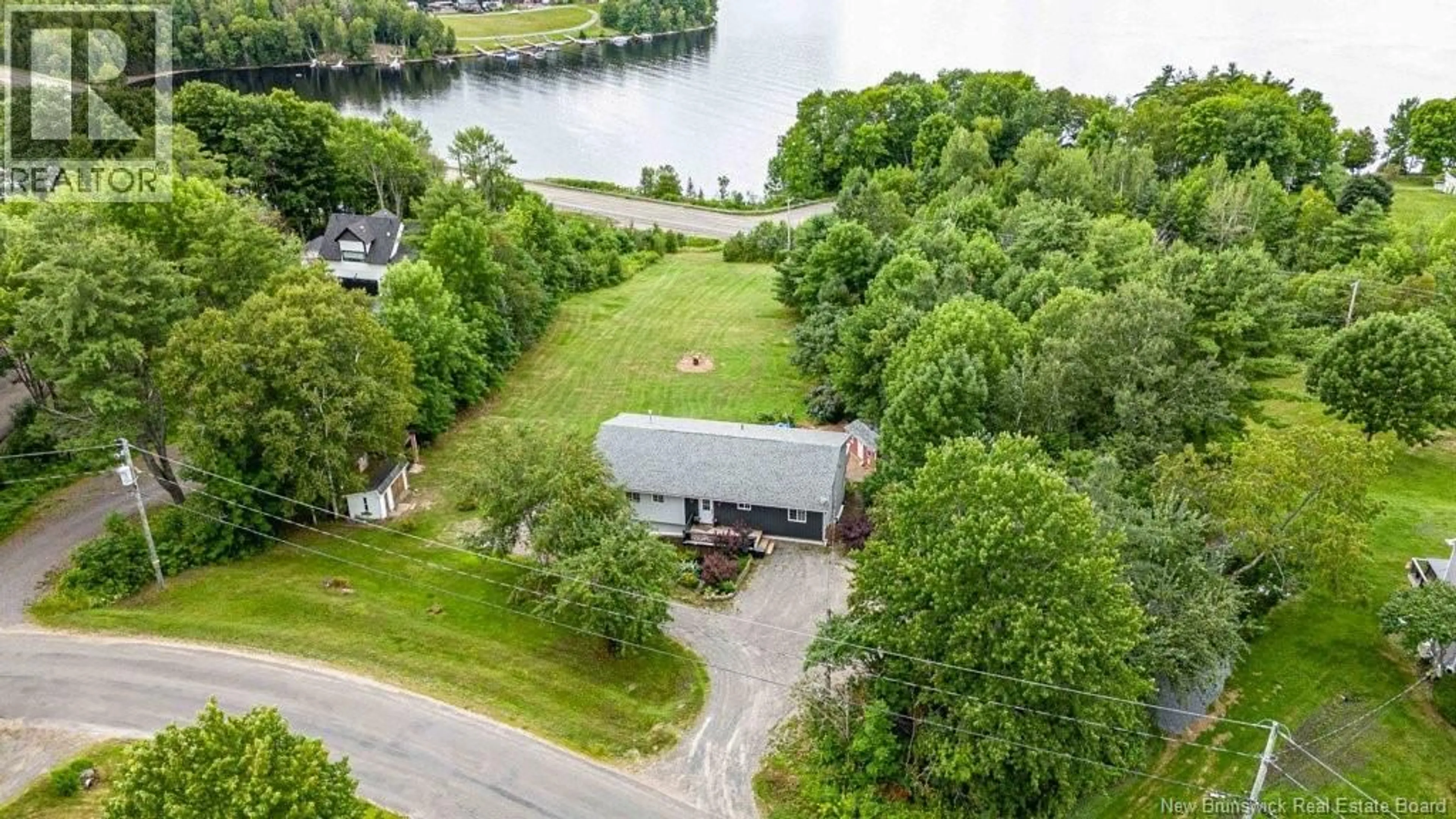 A pic from outside/outdoor area/front of a property/back of a property/a pic from drone, water/lake/river/ocean view for 50 WOODBINE LANE, Upper Kingsclear New Brunswick E3E1S1
