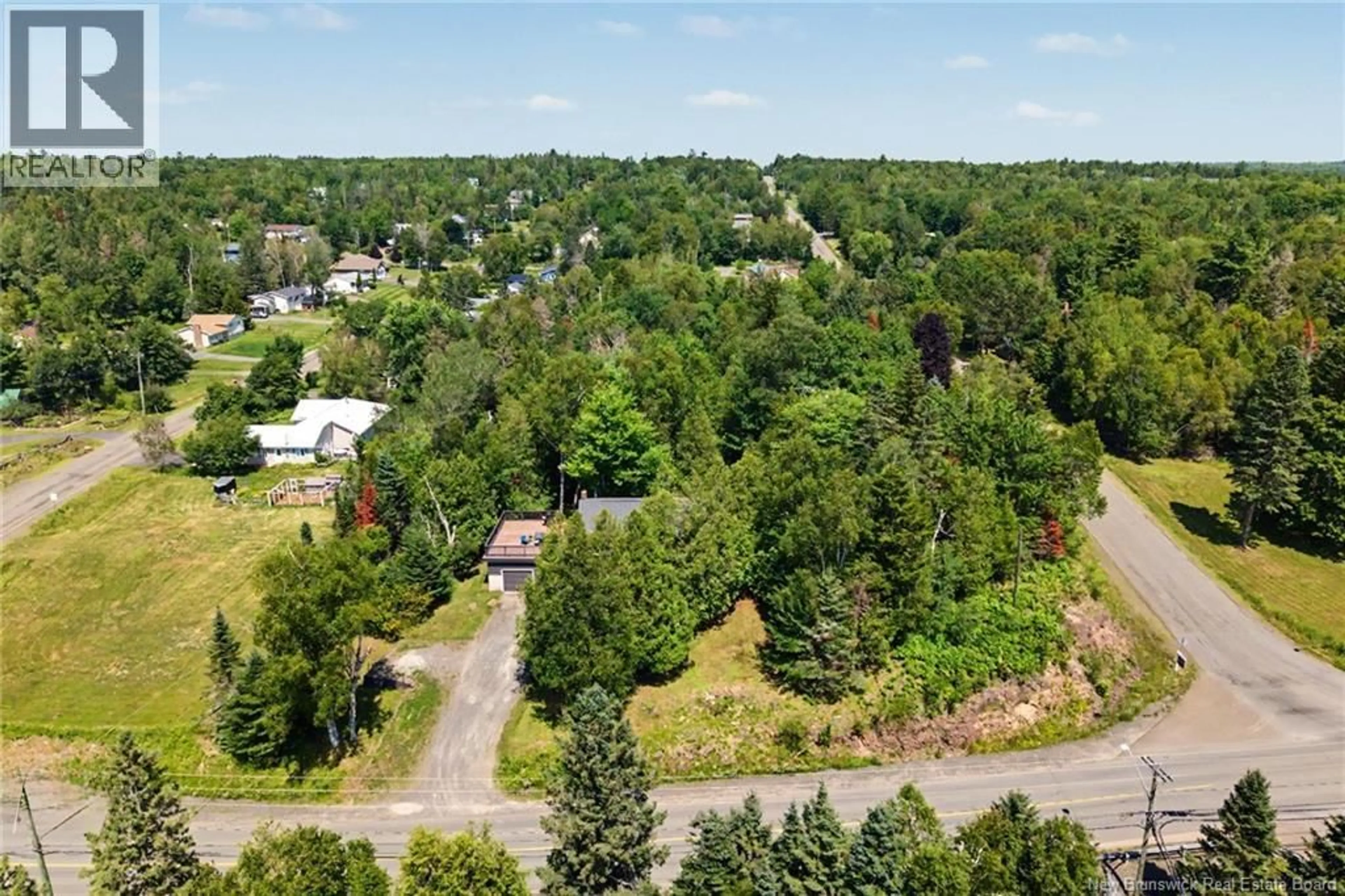 A pic from outside/outdoor area/front of a property/back of a property/a pic from drone, forest/trees view for 188 CARLISLE RD, Douglas New Brunswick E3G7N5
