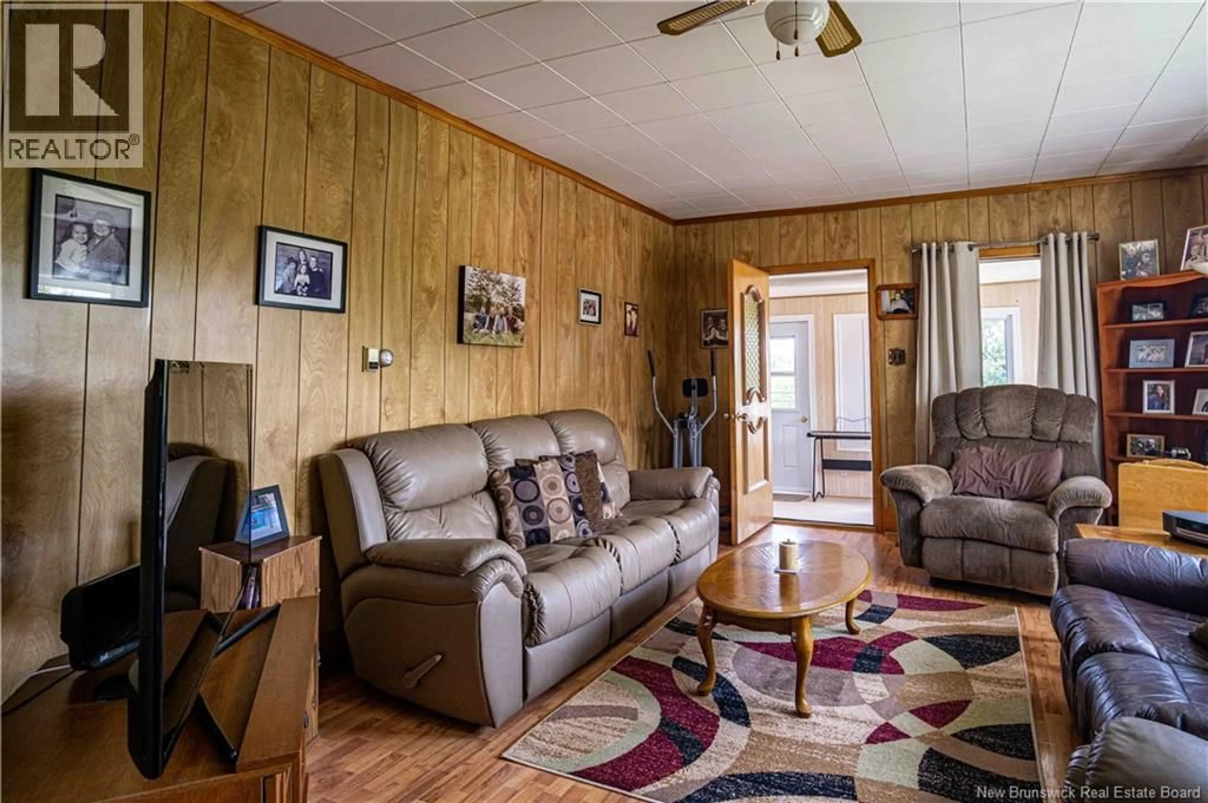 Living room with furniture, wood/laminate floor for 261 MAIN STREET, Plaster Rock New Brunswick E7G2G4