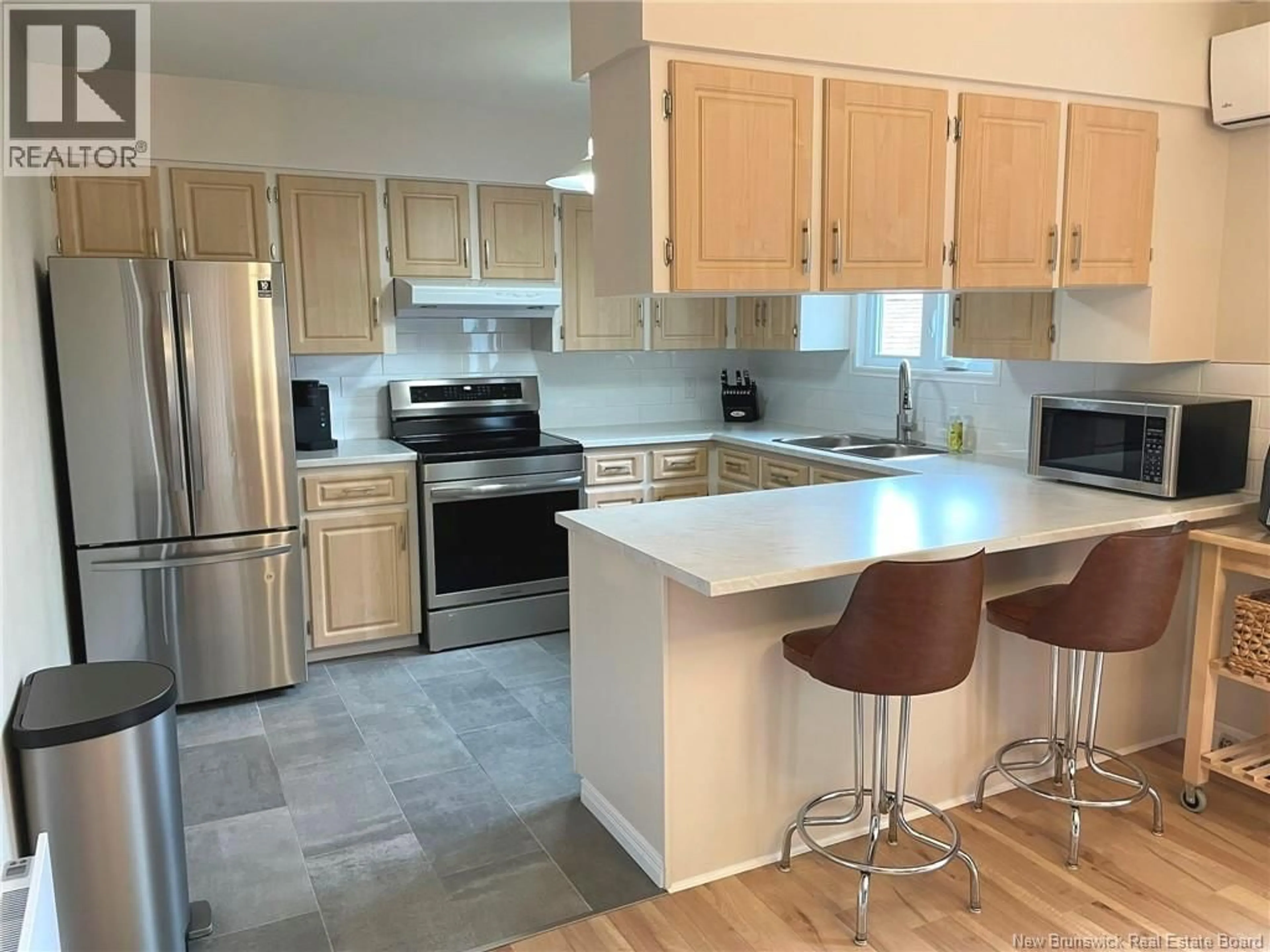 Open concept kitchen, ceramic/tile floor for 4 EMILE-SIMARD AVENUE, Edmundston New Brunswick E3V3P9