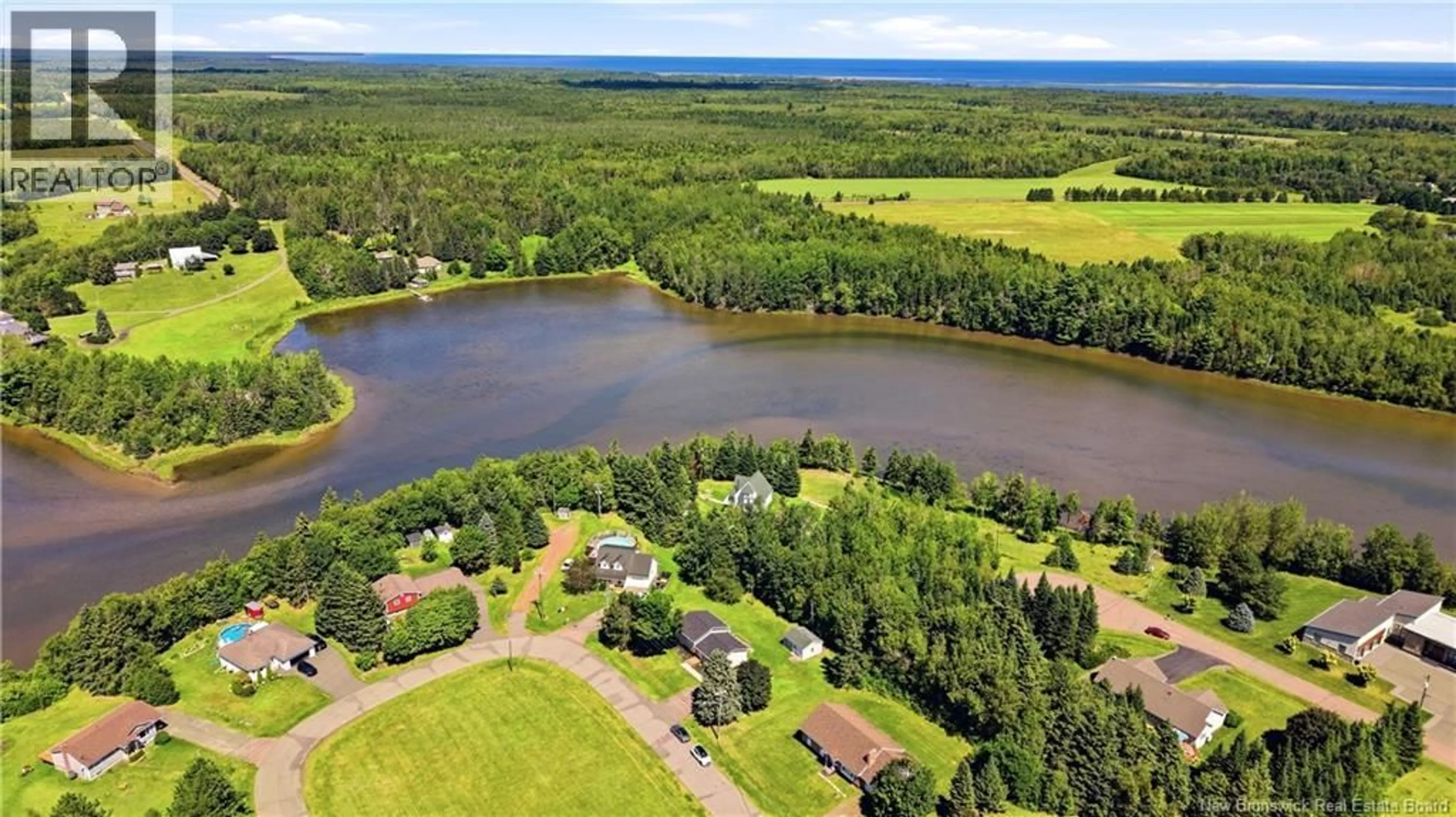 A pic from outside/outdoor area/front of a property/back of a property/a pic from drone, water/lake/river/ocean view for 35 RUE DES ROCHES, Bouctouche New Brunswick E4S3B4