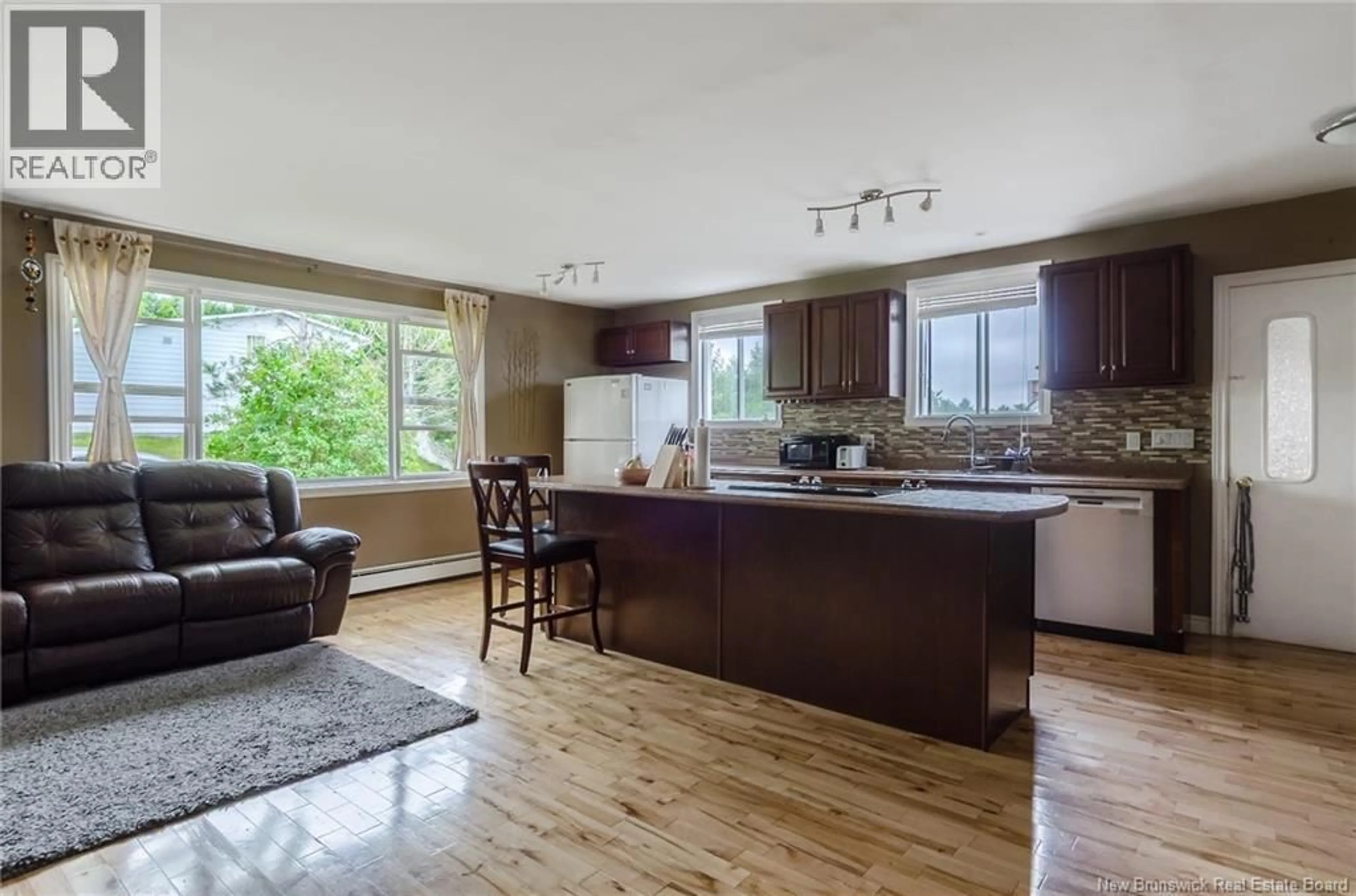 Open concept kitchen, wood/laminate floor for 146 WYATT CRESCENT, Saint John New Brunswick E2J4E1