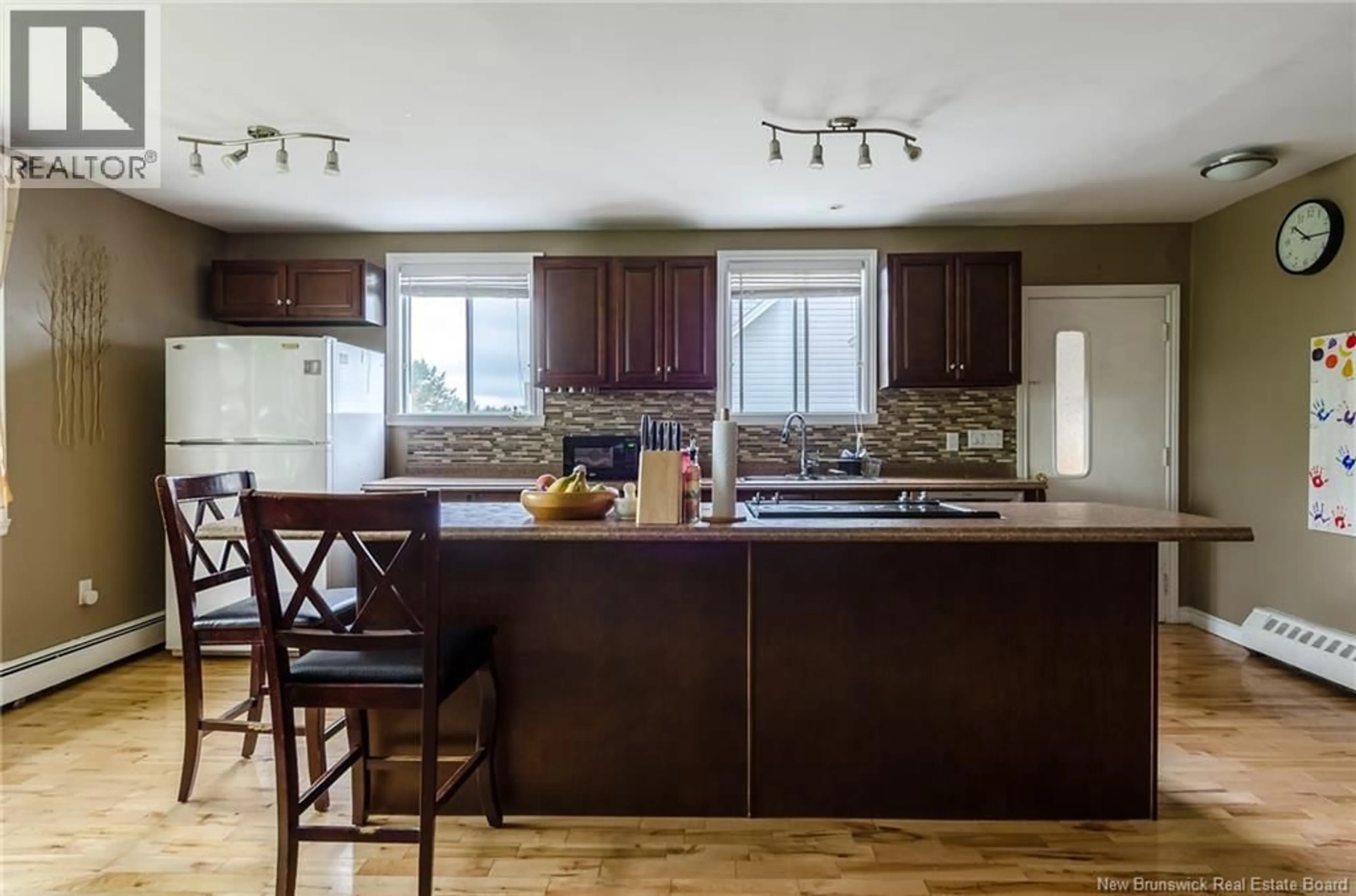 Open concept kitchen, wood/laminate floor for 146 WYATT CRESCENT, Saint John New Brunswick E2J4E1