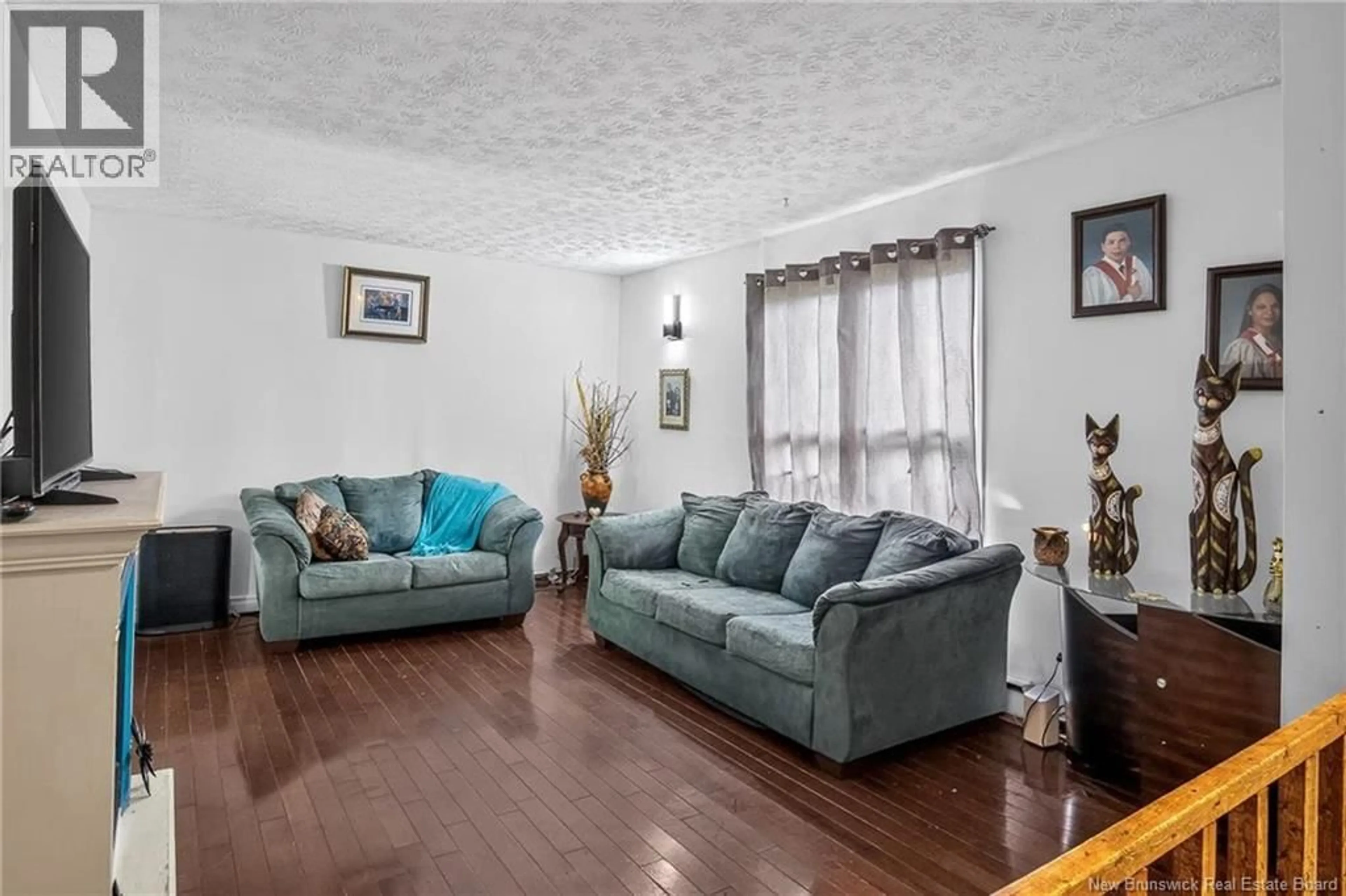 Living room with furniture, wood/laminate floor for 68-70 BELGIAN ROAD, Saint John New Brunswick E2H2A8