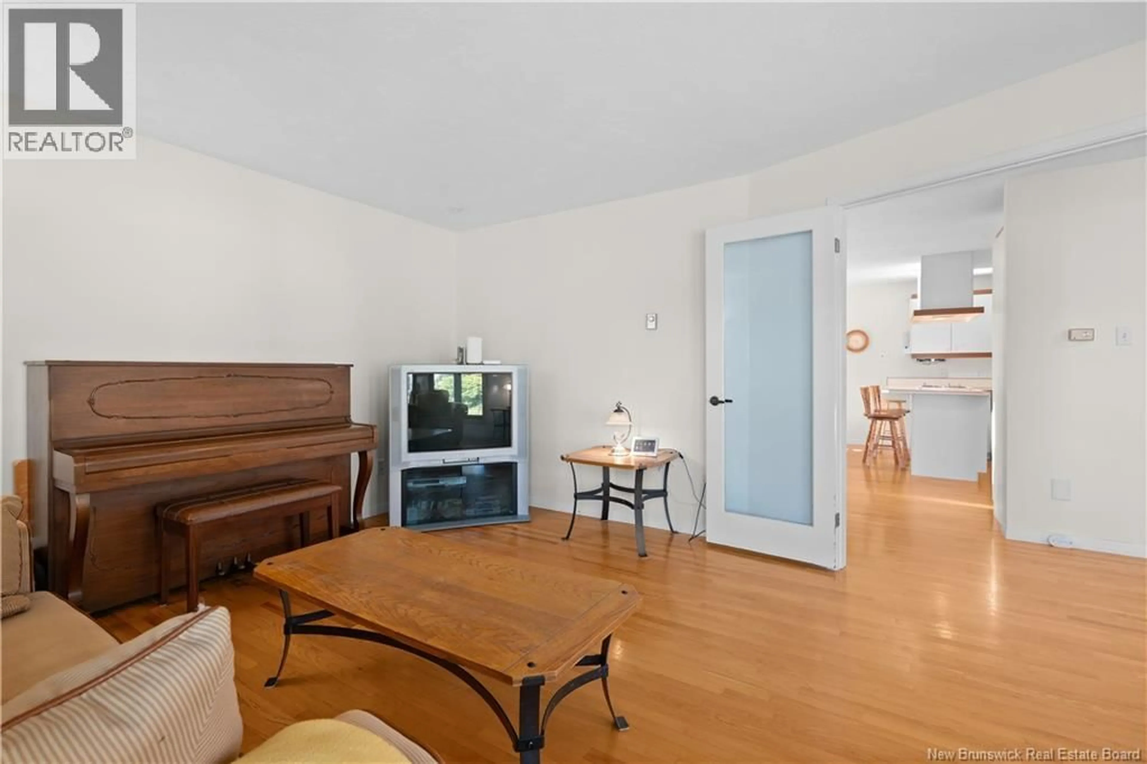 Living room with furniture, wood/laminate floor for 22 CHIASSON COURT, Dieppe New Brunswick E1A6J4