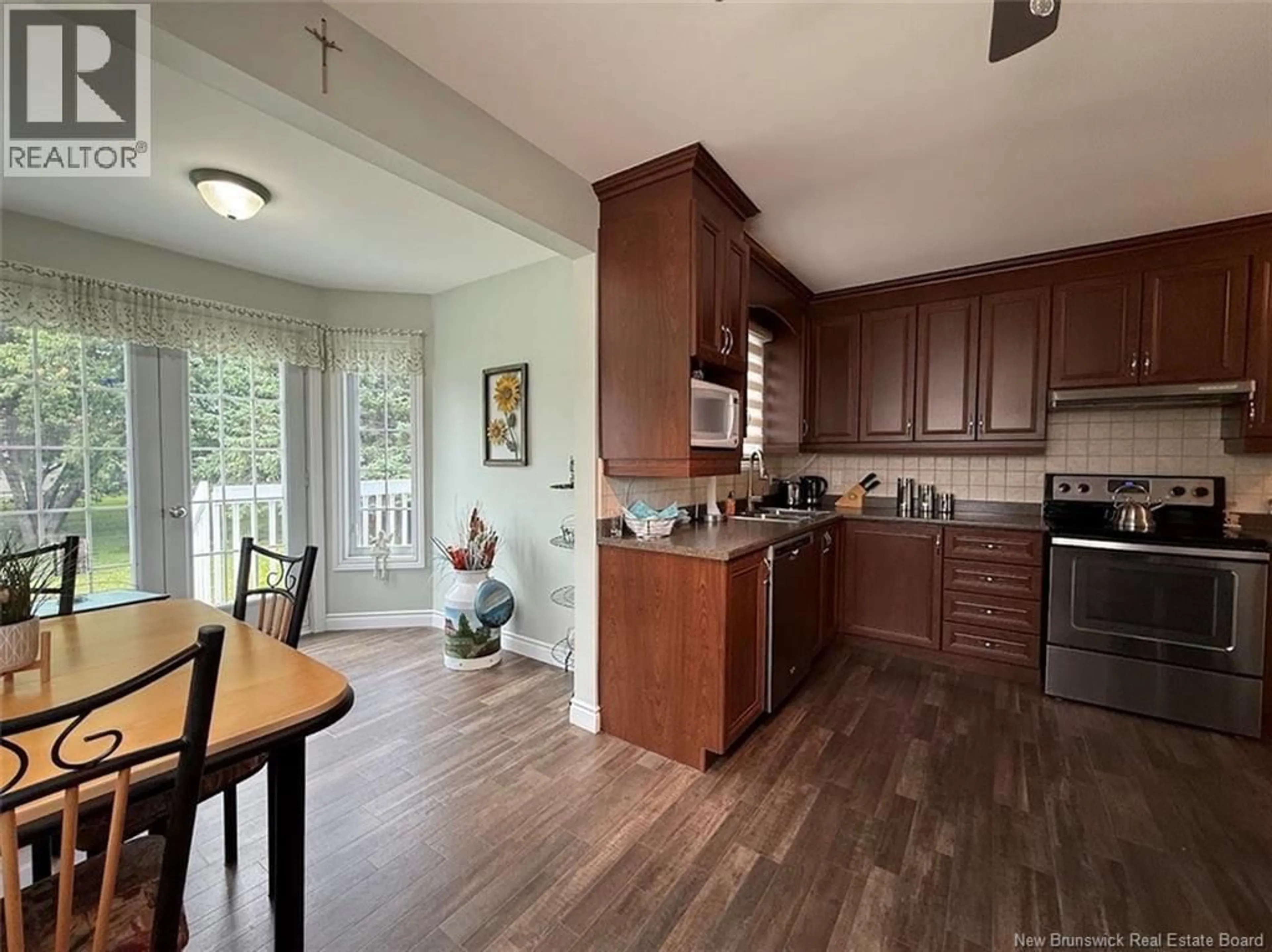 Open concept kitchen, wood/laminate floor for 26 DES SOEURS STREET, Saint-Jacques New Brunswick E7B1G6