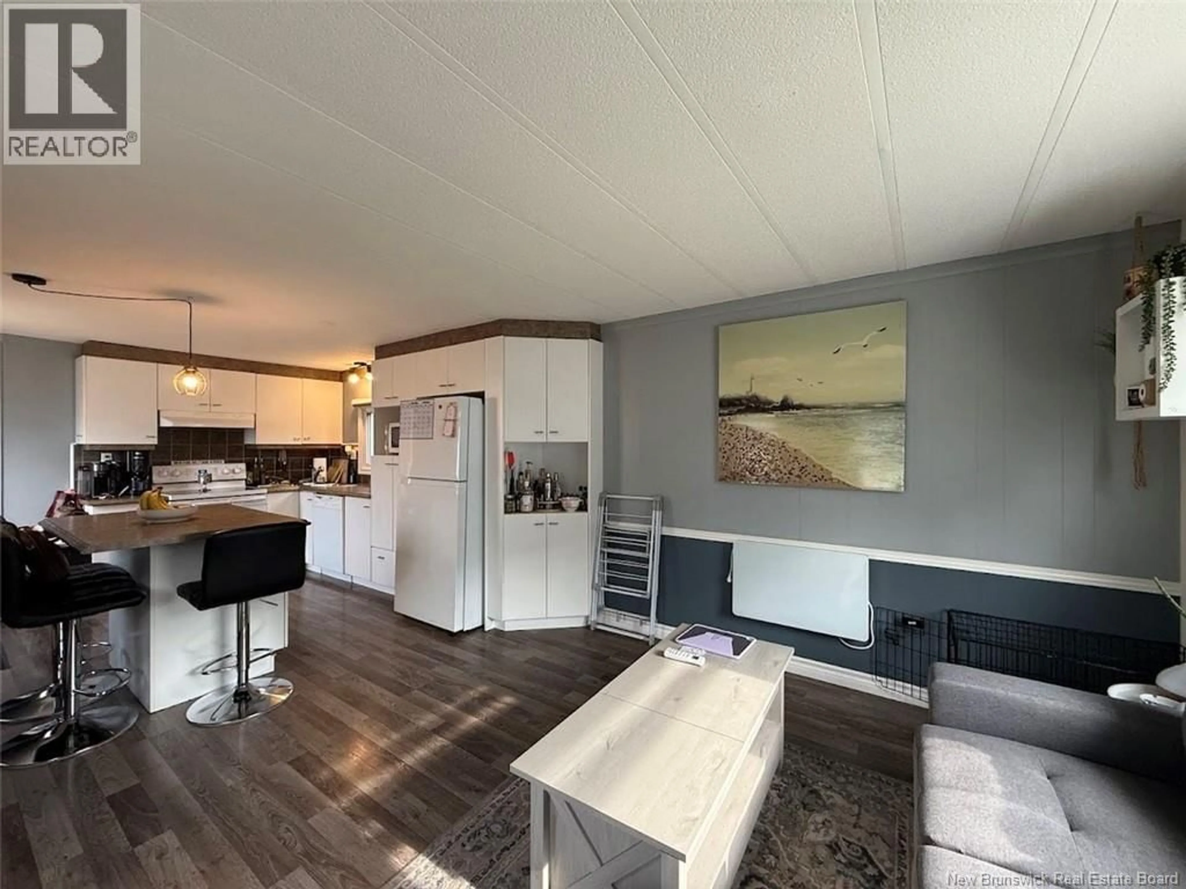 Open concept kitchen, wood/laminate floor for 18 PARC P'TISO STREET, Edmundston New Brunswick E3V3X7
