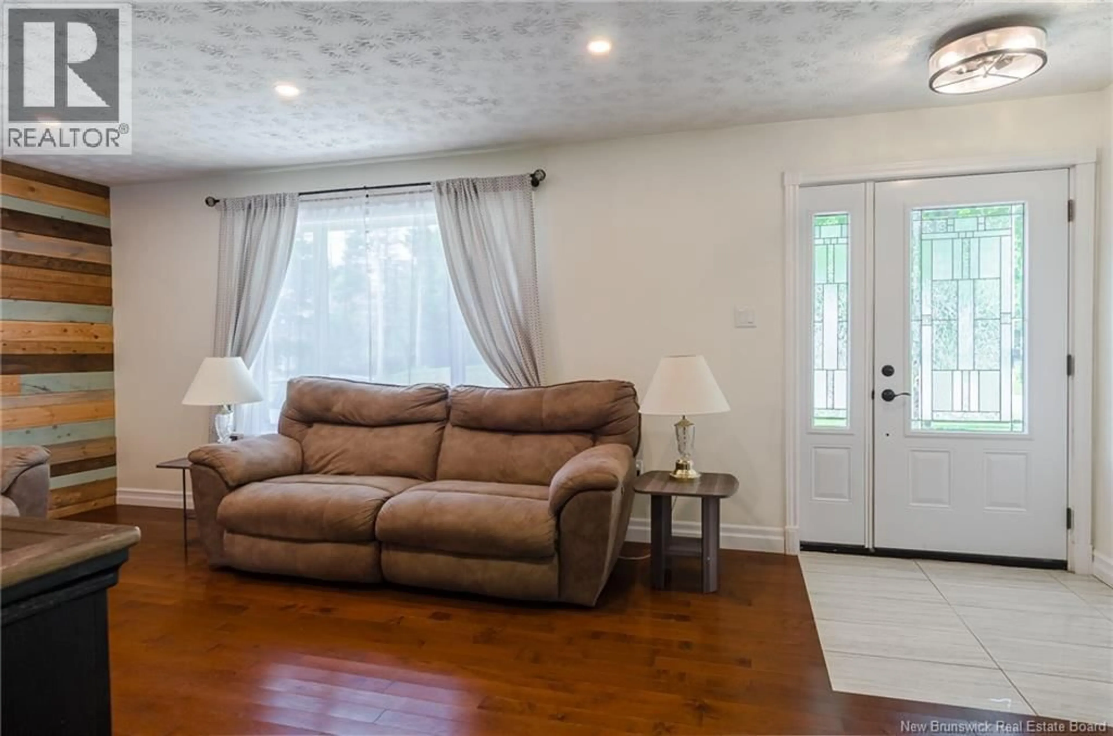 Living room with furniture, wood/laminate floor for 44 WEDGEWOOD DRIVE, Rothesay New Brunswick E2E3P8