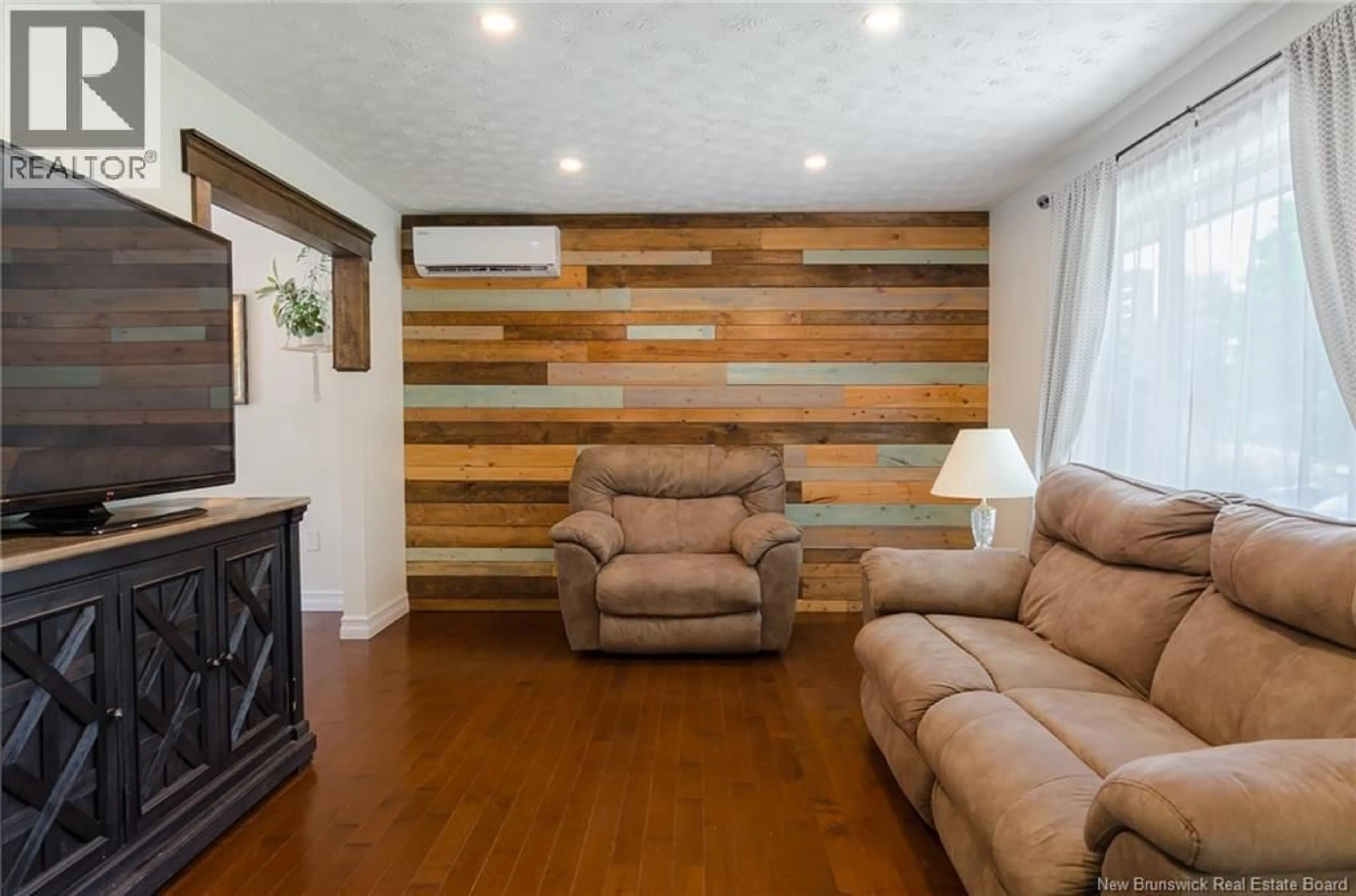 Living room with furniture, wood/laminate floor for 44 WEDGEWOOD DRIVE, Rothesay New Brunswick E2E3P8
