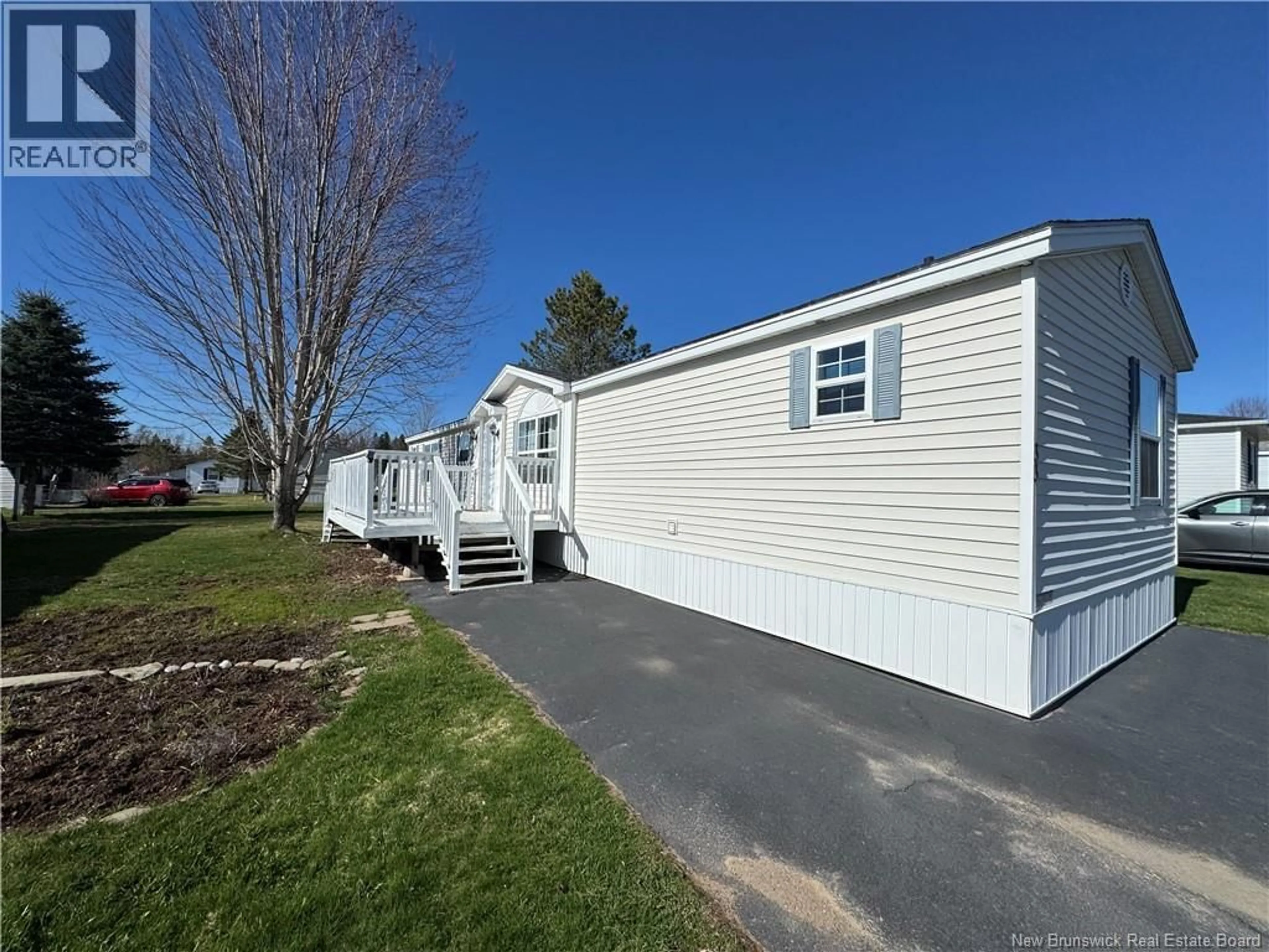 Home with vinyl exterior material, street for 33 FIRST STREET, Sussex Corner New Brunswick E4E2W2