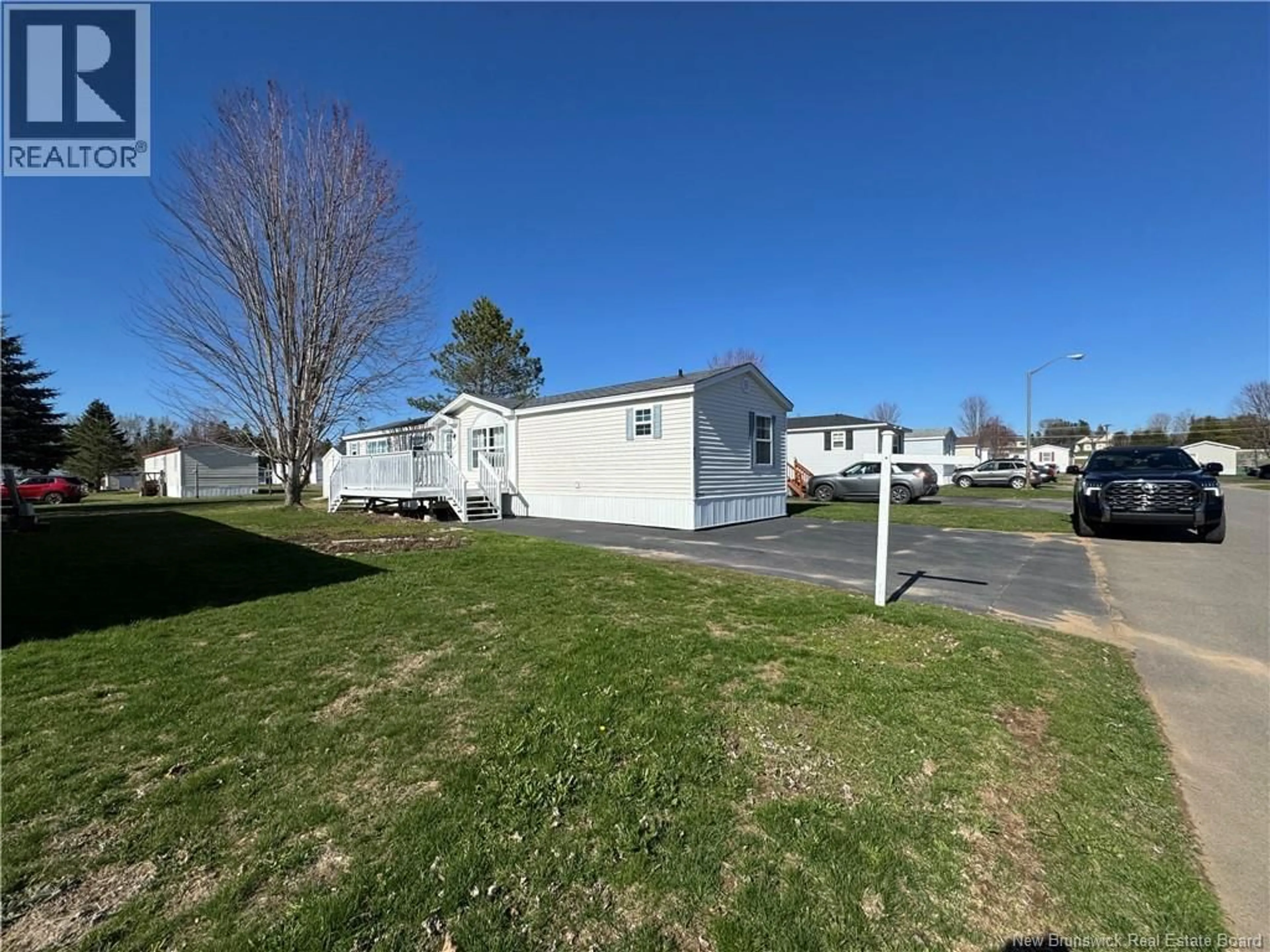 A pic from outside/outdoor area/front of a property/back of a property/a pic from drone, street for 33 FIRST STREET, Sussex Corner New Brunswick E4E2W2
